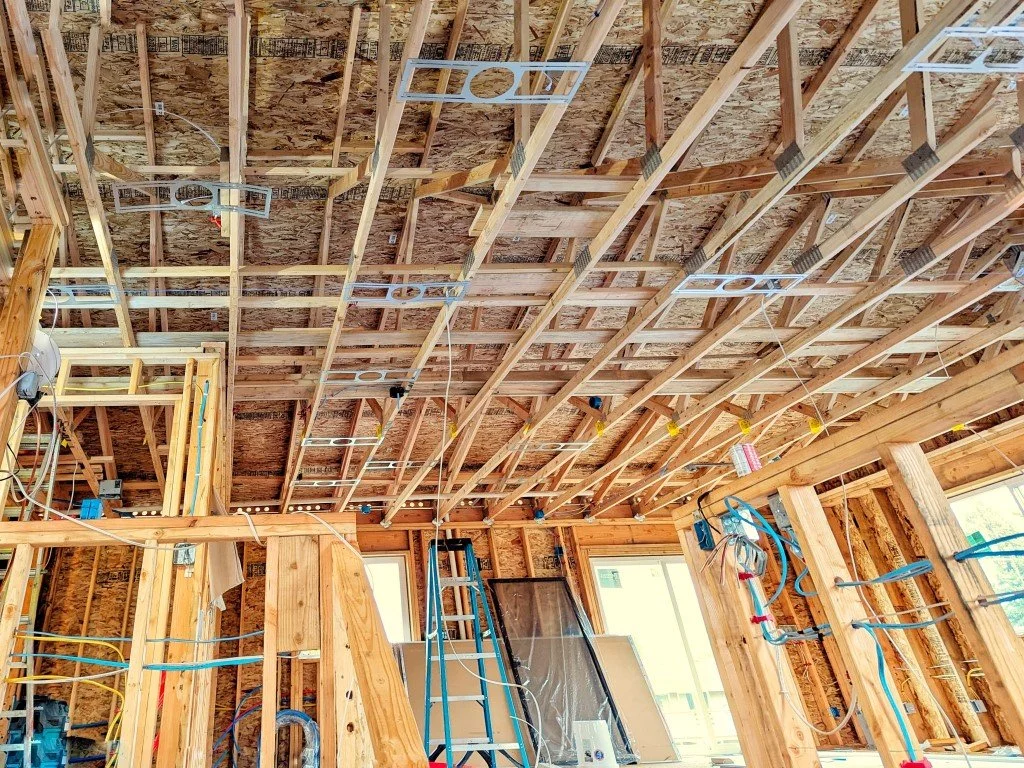 Exposed overhead framing on second floor of a single family residence under new build construction.