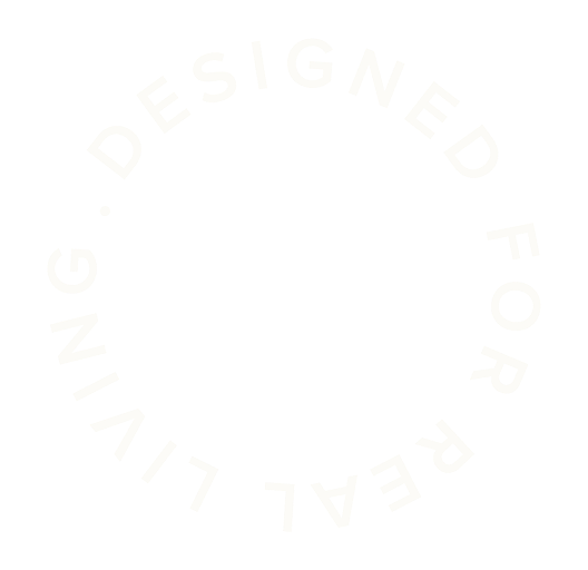 Circular text reading 'Designed for Real Living' surrounding an empty black circle.