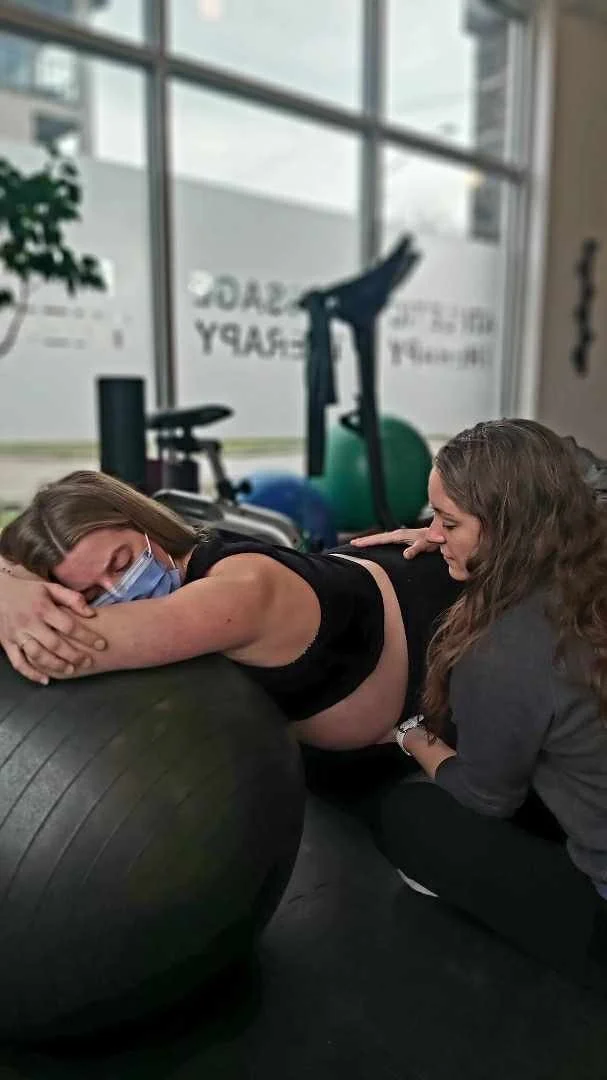 Athletic Therapist Nikki doing craniosacral therapist on a pregnant client