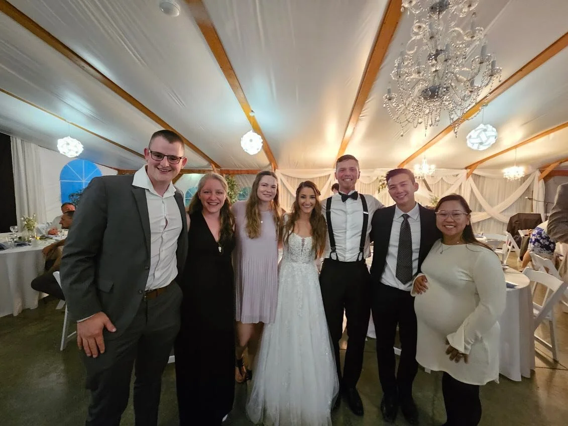 The revolution team gathered at a wedding