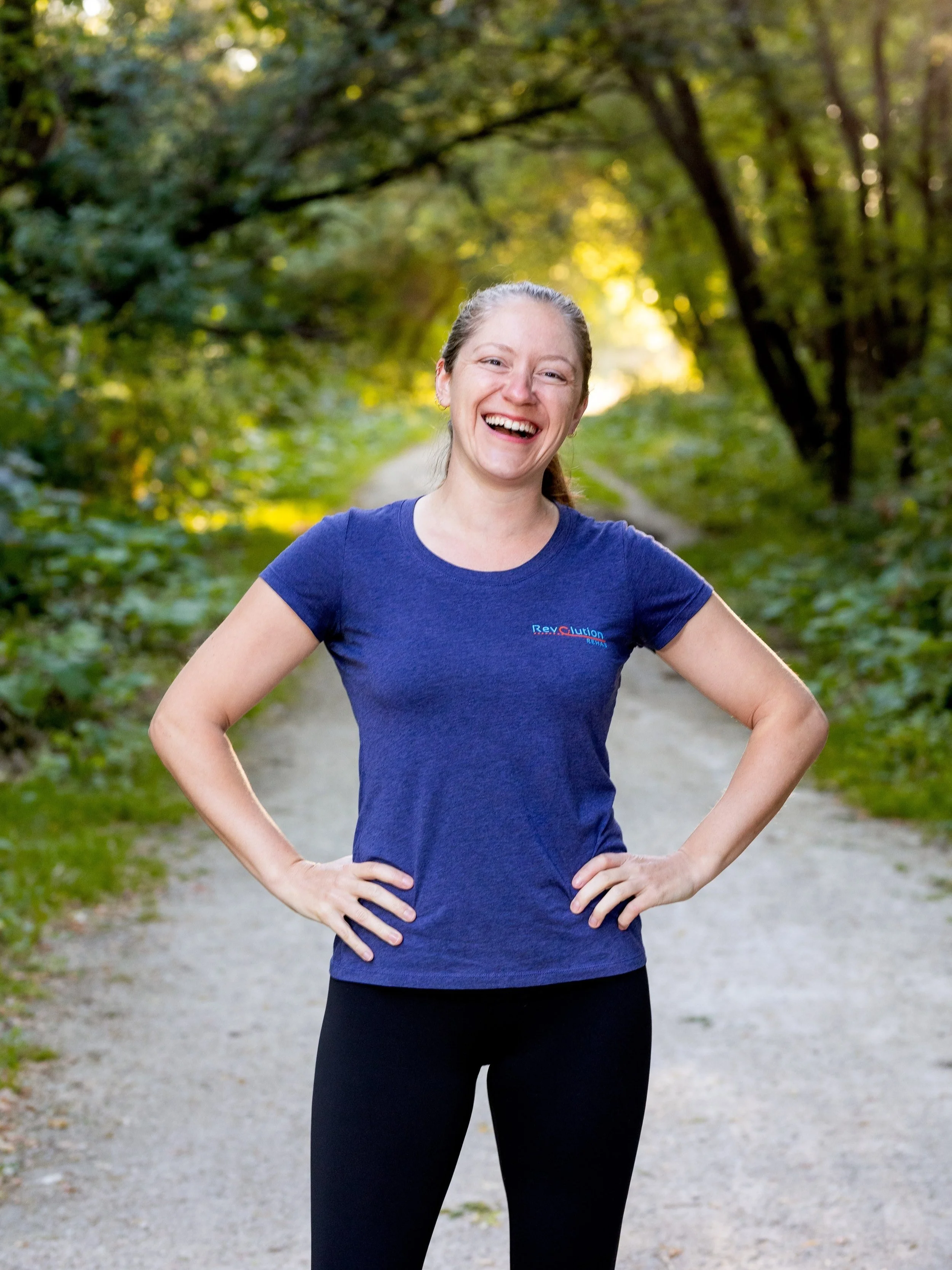 Revolution Rehab owner Nikki Smith standing with a smile and hands on her hips.