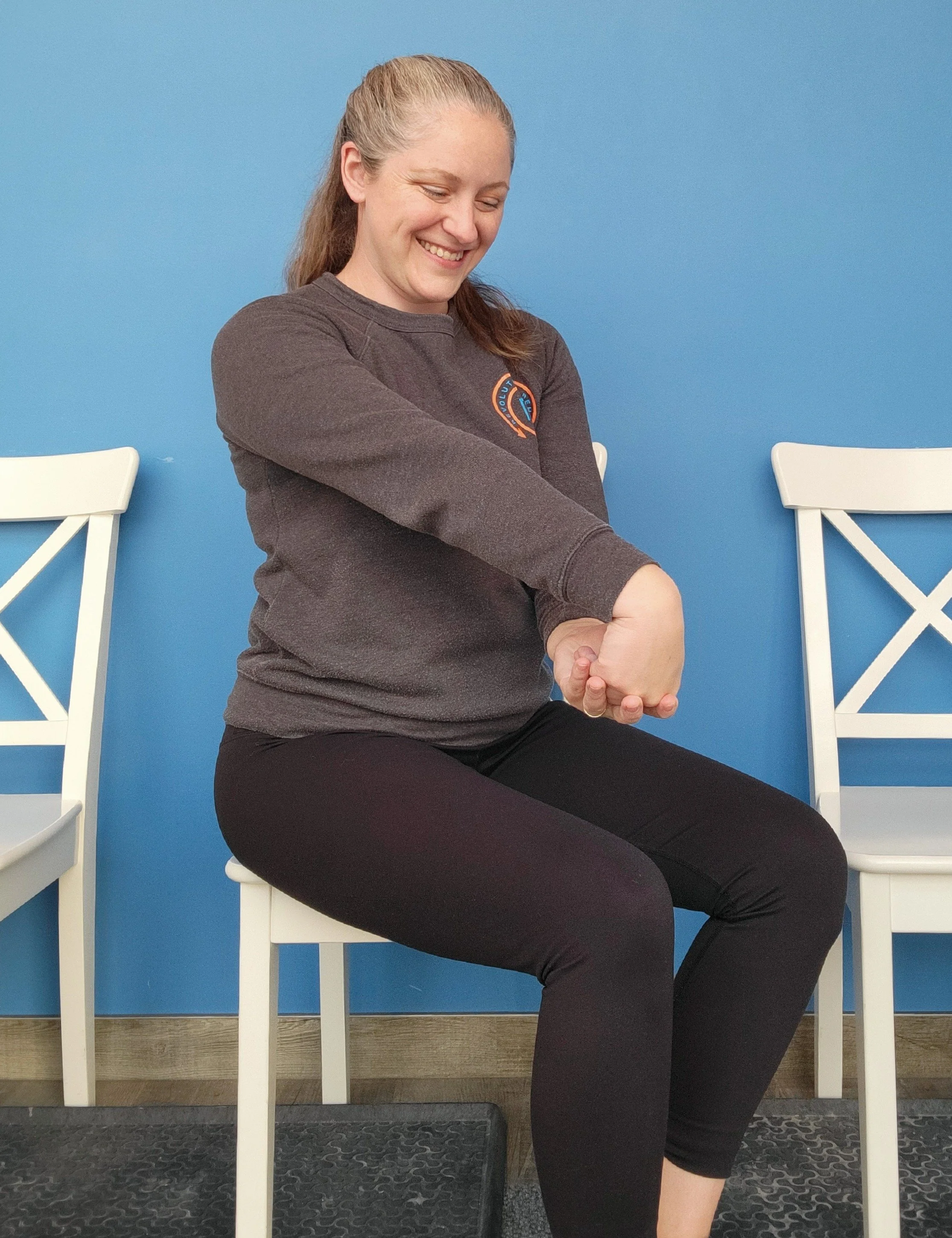 Nikki Smith showing a forearm extensor stretch for tennis elbow.