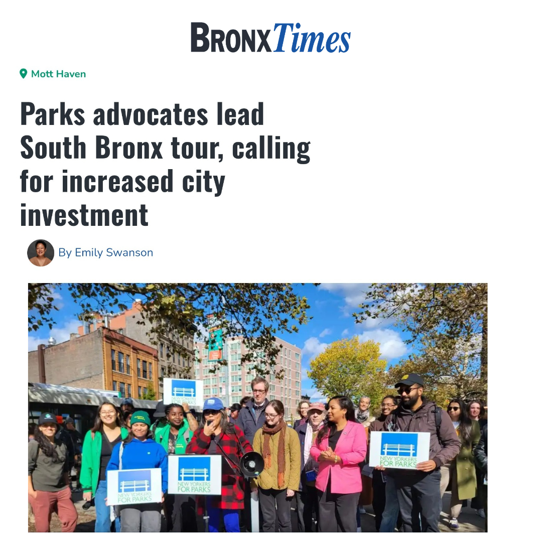 Group of protesters participating in a demonstration, holding signs that read 'New Yorkers for Parks,' outdoors with trees and buildings in the background.