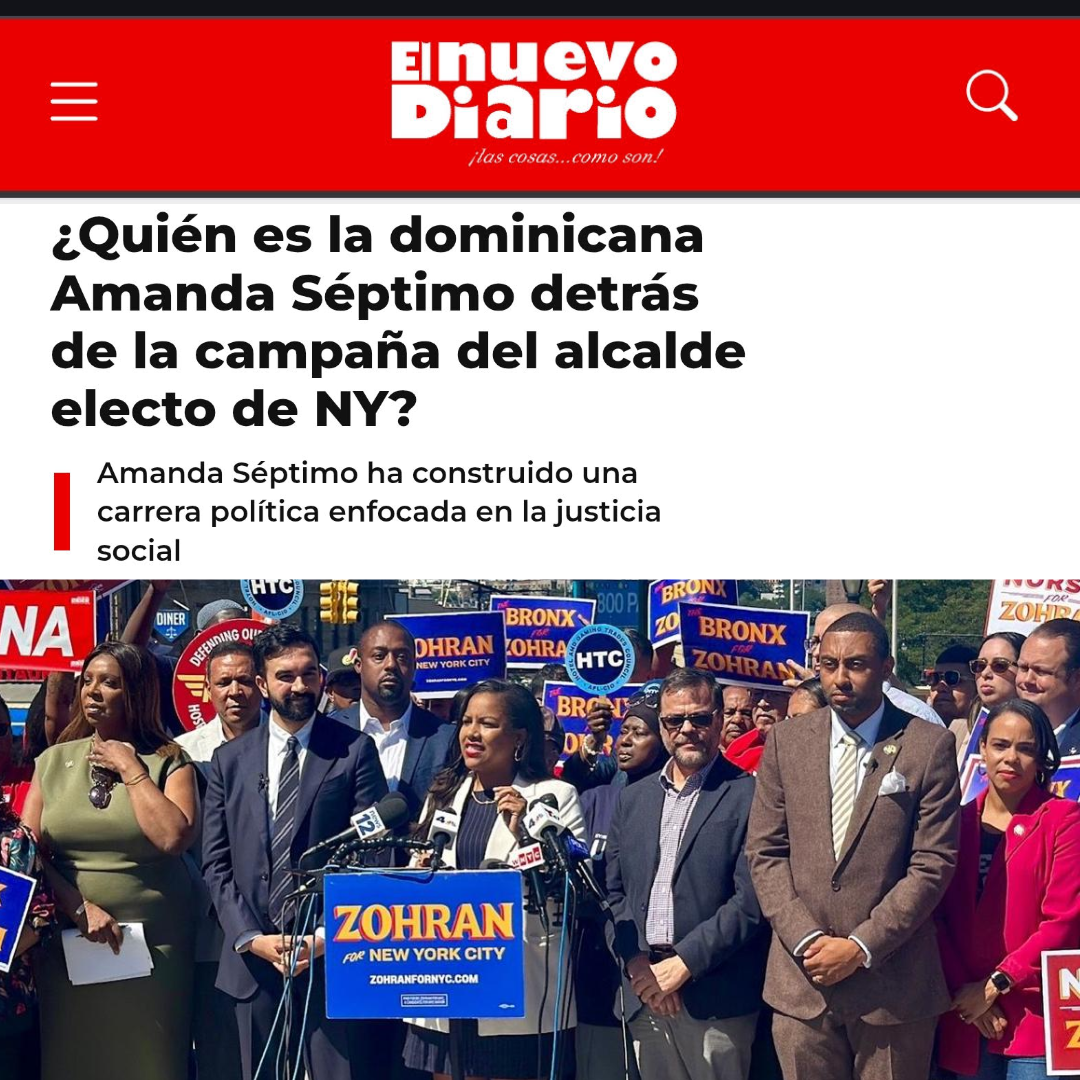 Group of people participating in a political campaign event, holding signs with candidate names like 'Zohan' and 'Bronx,' standing outdoors with microphones in front of a speaker.