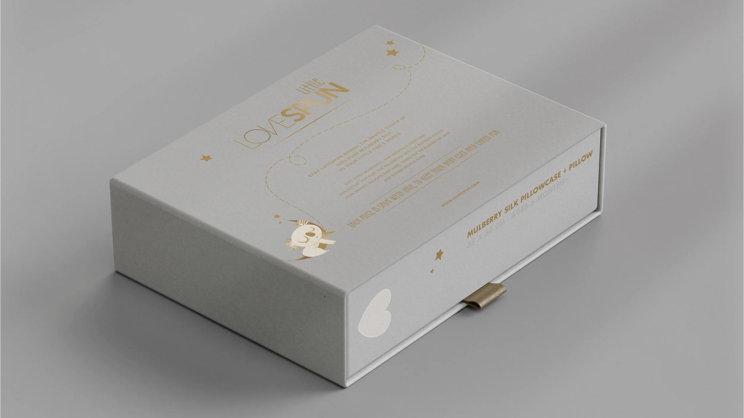 The back look of Little Lovespun packaging in a luxurious grey color and golden font of the brand name and few elements like stars and white koala sleping on top of crescent moon
