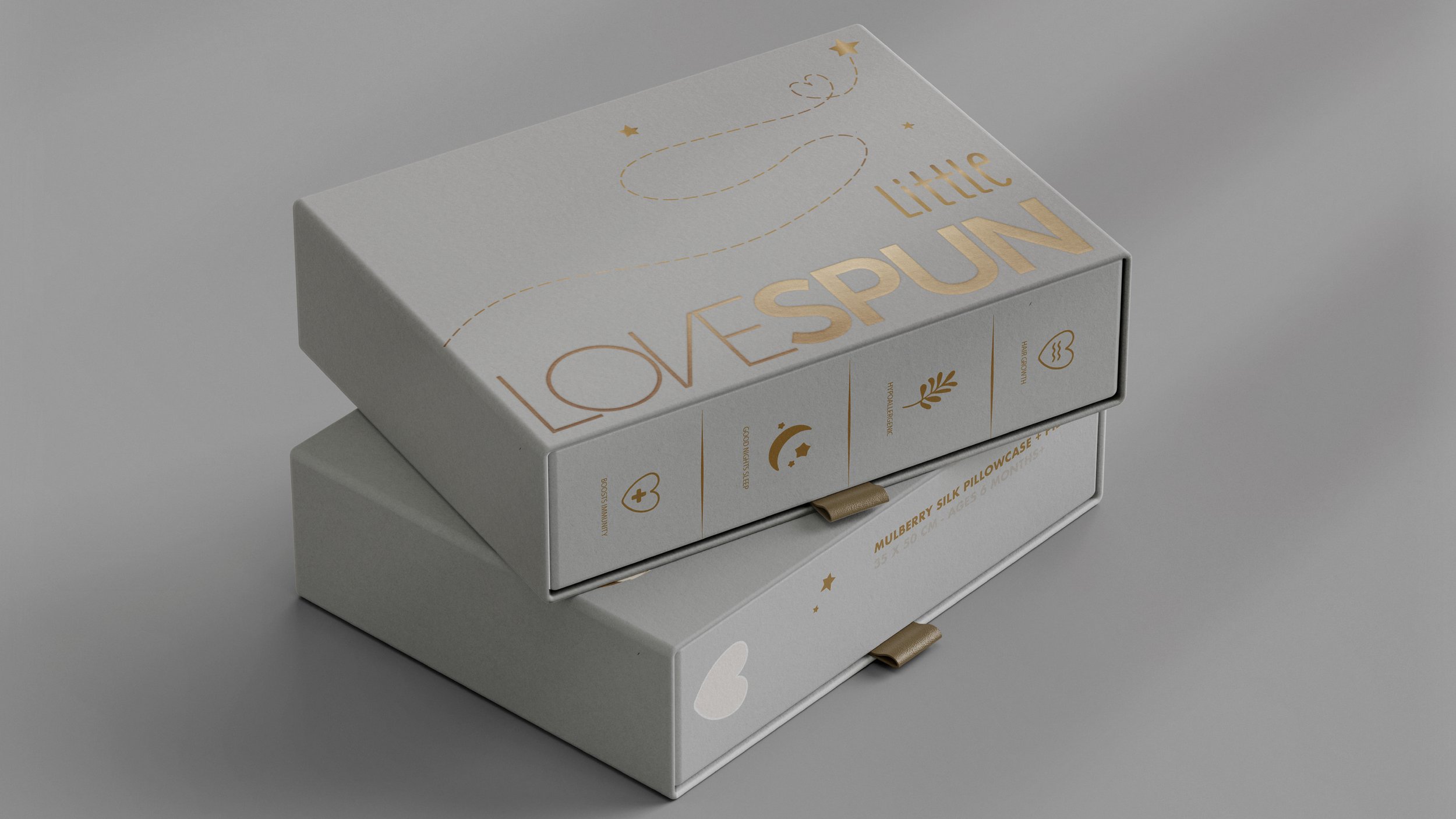 Little Lovespun packaging in a luxurious grey color and golden font of the brand name and few elements like stars