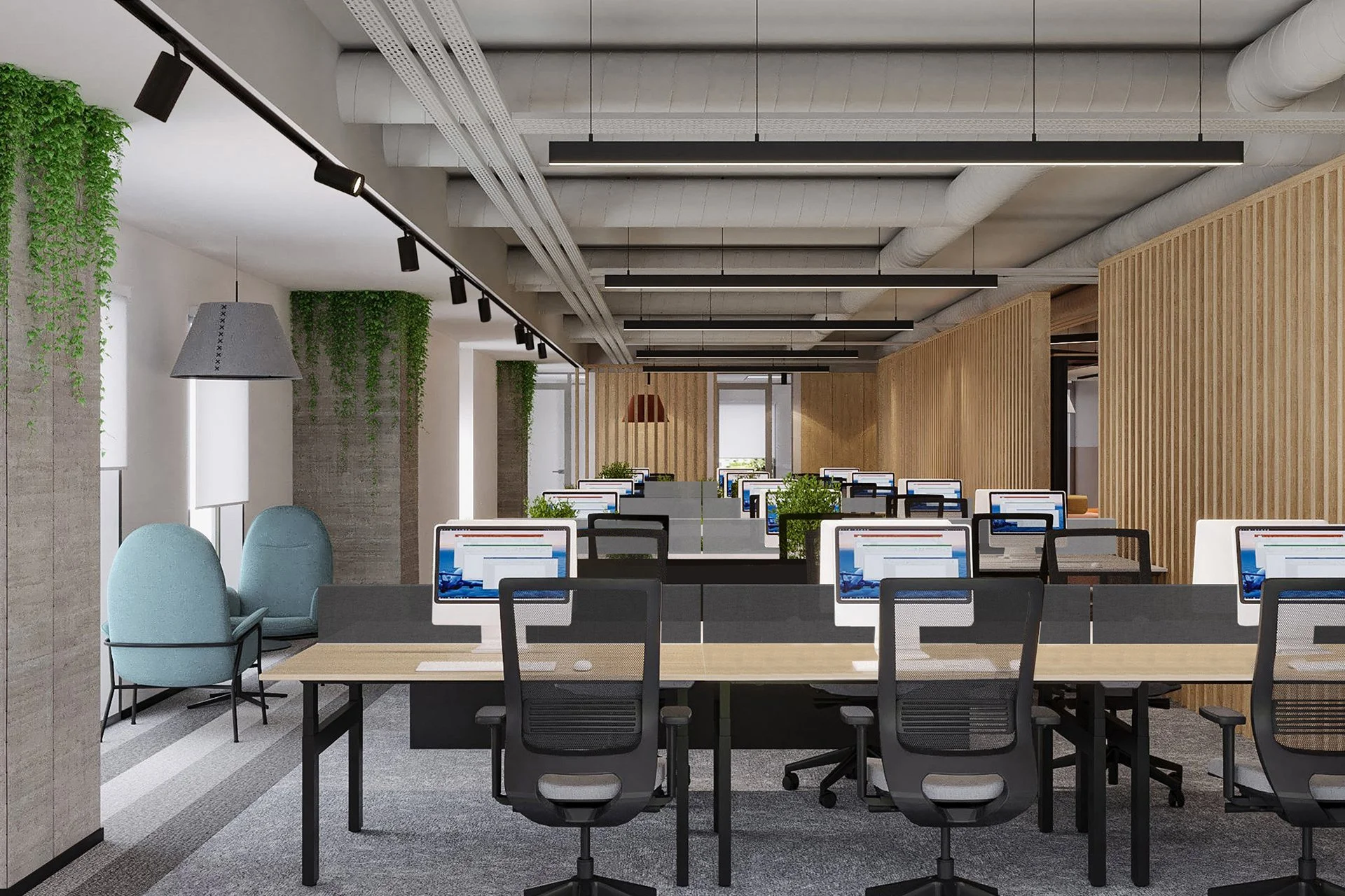 Modern open-plan office with rows of desks, computer monitors, black chairs, and green plants. Light wood paneling and ceiling air ducts are visible.