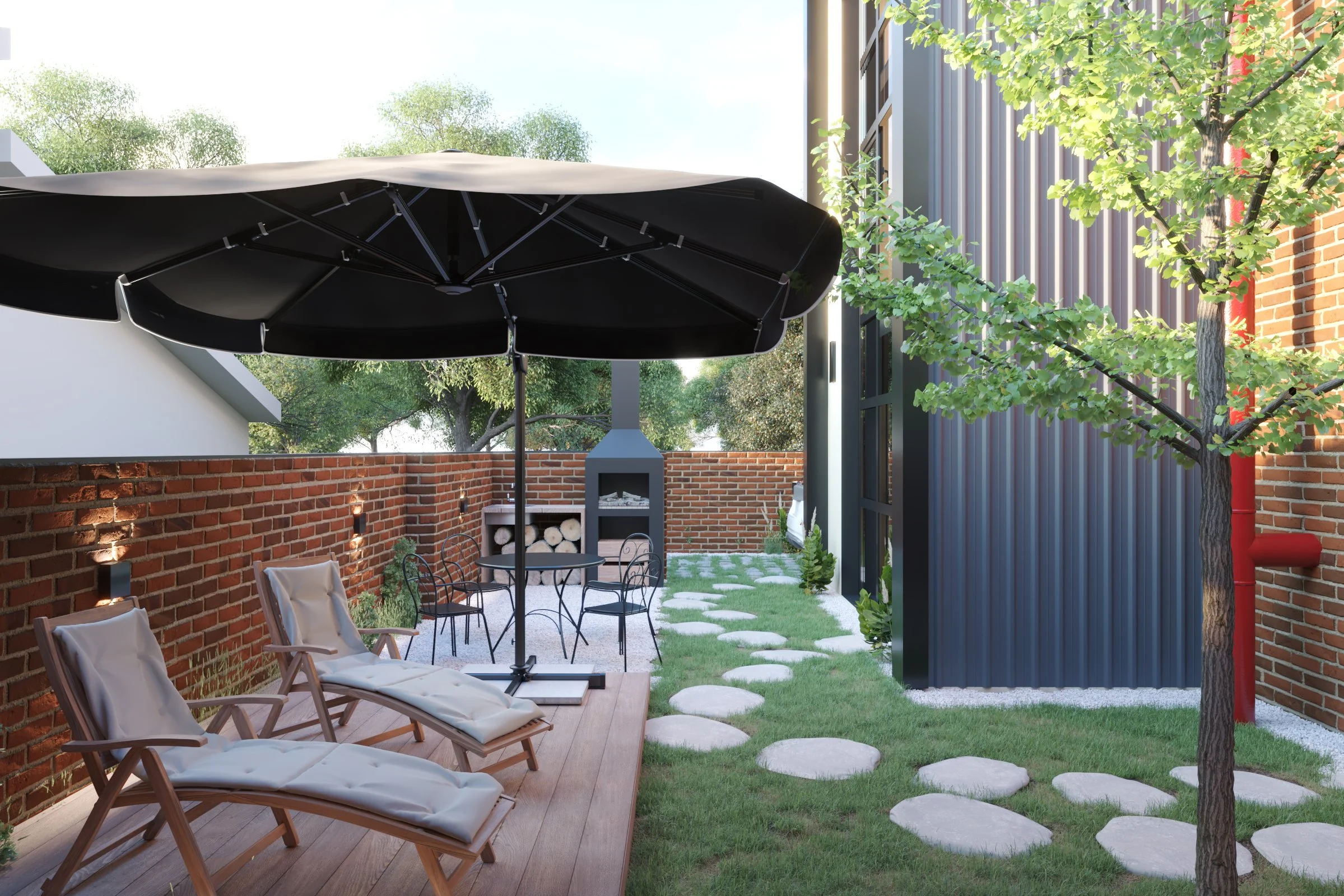 A backyard patio with lounge chairs, a black umbrella, a small dining table with metal chairs, a wood-fired pizza oven, and a grassy area with stepping stones, surrounded by brick and metal walls, with trees and greenery.