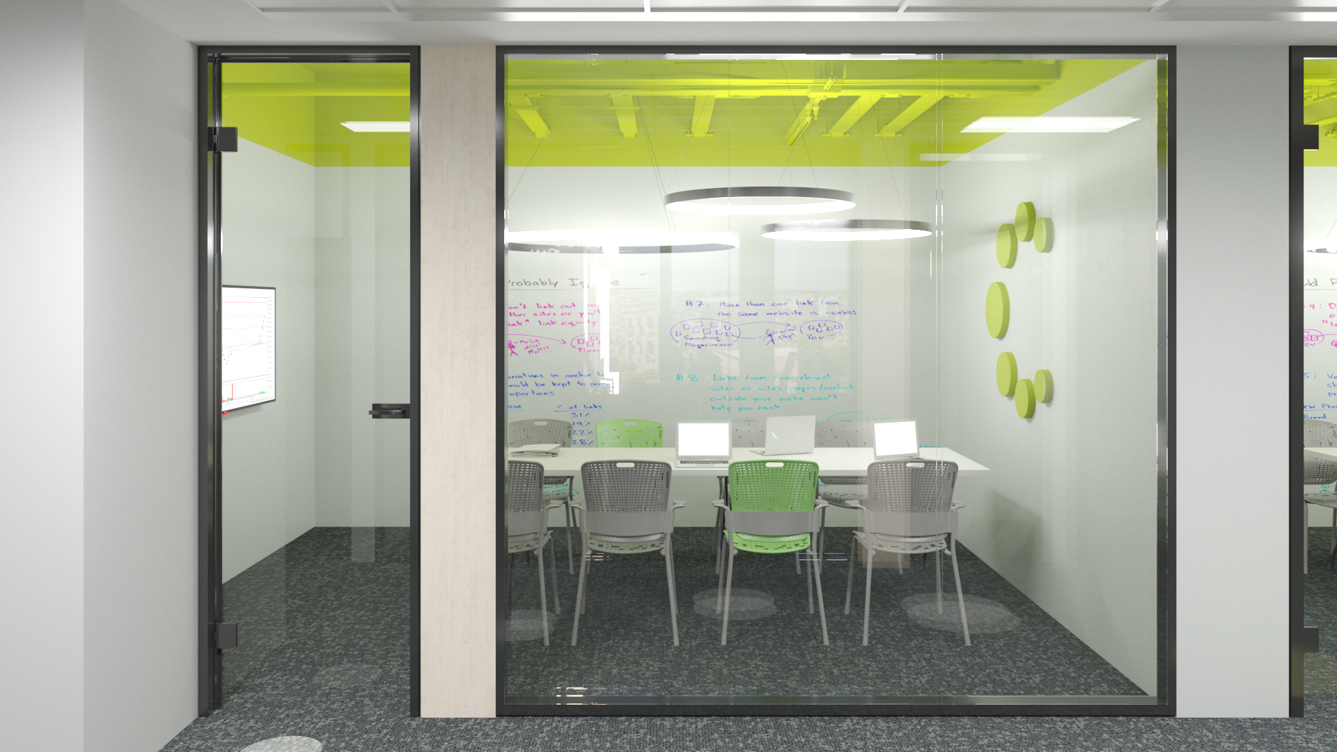 Modern conference room with glass walls, green and gray chairs, whiteboard with colorful writing, and ceiling lights.