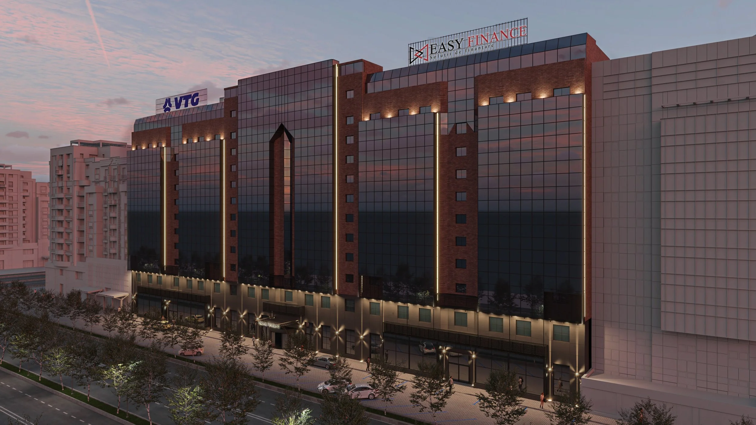 Nighttime street view of a modern multi-story building with a reflective glass facade, illuminated vertical lines, and signs for VTG and Easy Finance on the roof.