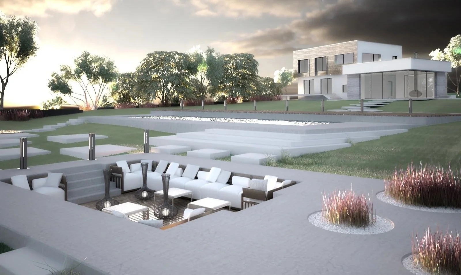 A modern backyard with a patio seating area, a tiered lawn, and a contemporary house in the background at sunset.