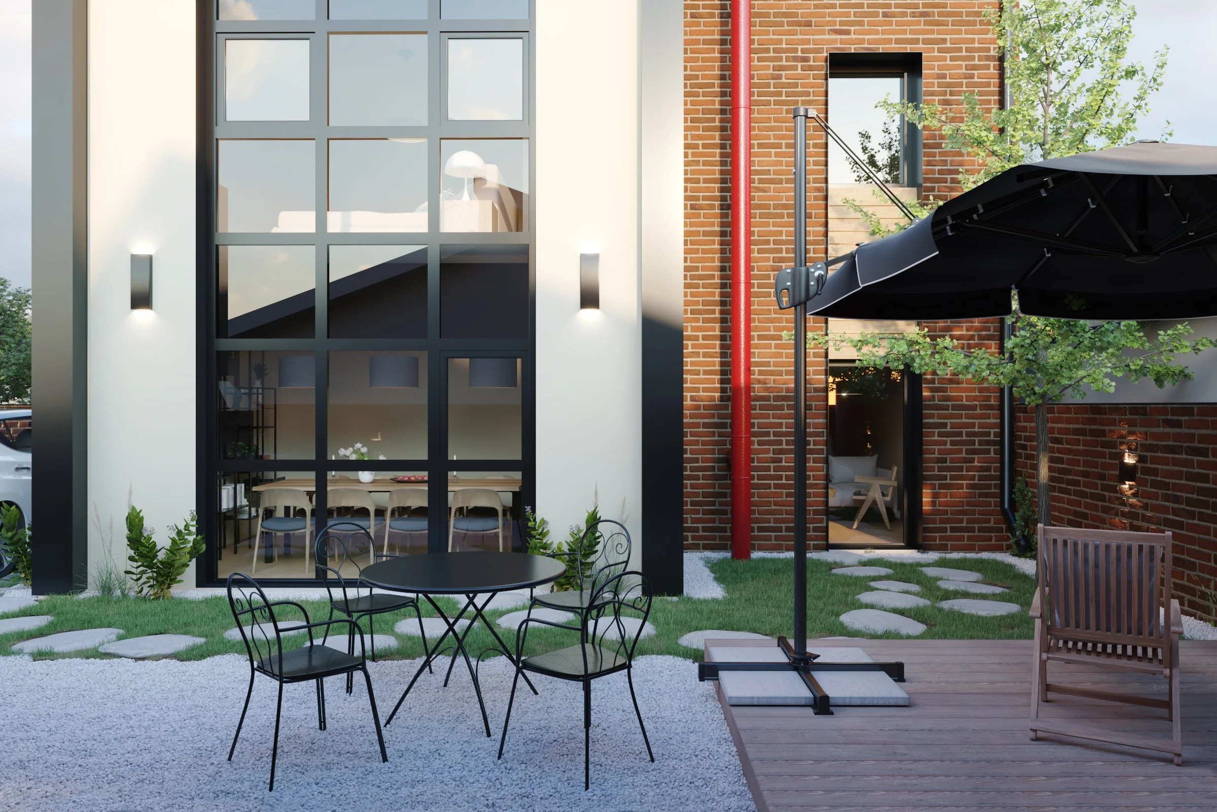 Modern exterior patio with black metal table and chairs, large black umbrella, stepping stones on grass, brick and white walls, large window, and a tree.