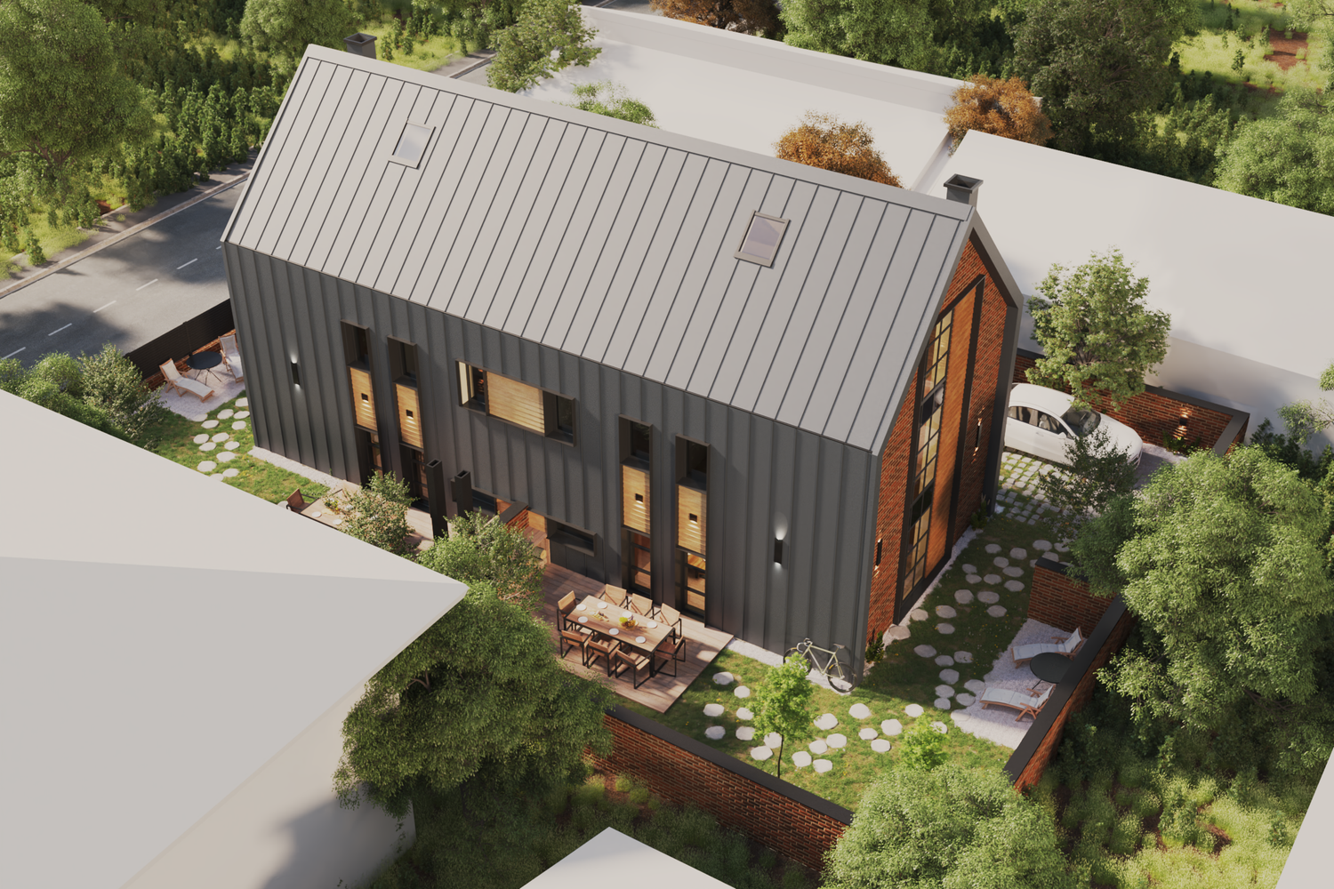 A modern house with a metal roof, outdoor dining area, and landscaped yard surrounded by lush trees.