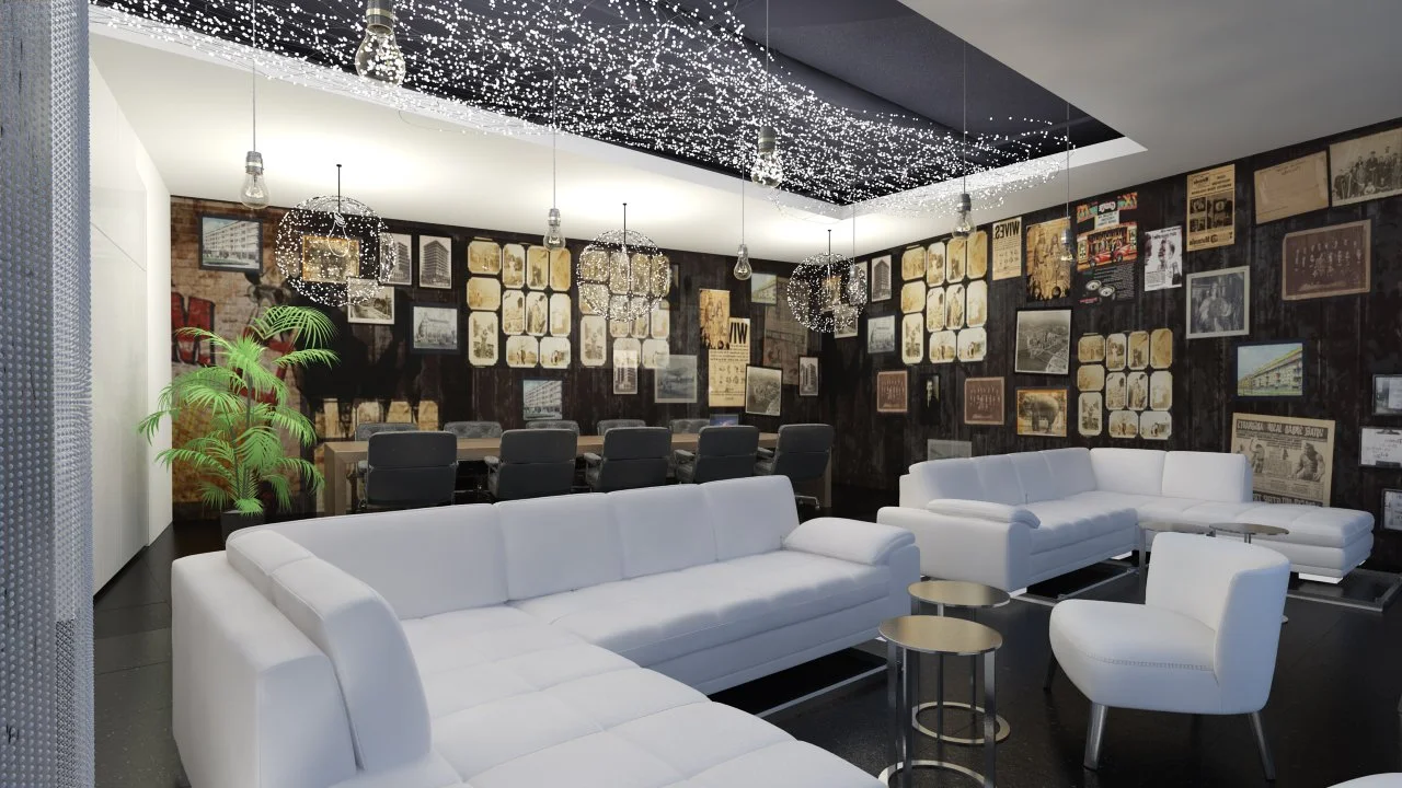 Modern lounge area with white sofas and armchairs, a long conference table with black chairs, wall decorated with vintage posters and photographs, hanging spherical light fixtures, and a decorative ceiling with string lights, in an office or co-working space.