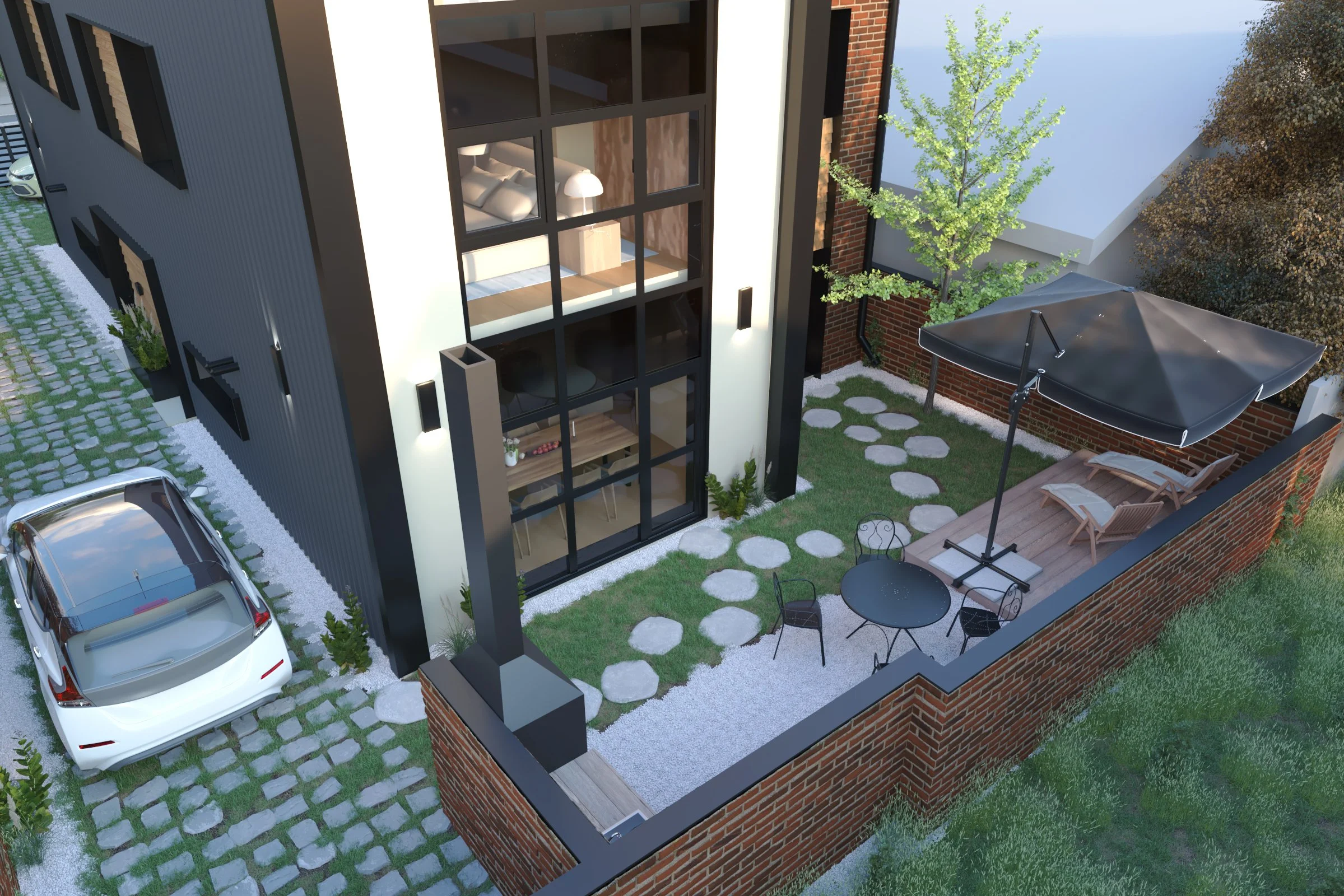 A modern outdoor patio area with a seating area, sun loungers with an umbrella, a small table, and stepping stones, surrounded by a brick wall and greenery, adjacent to a contemporary house with large windows.