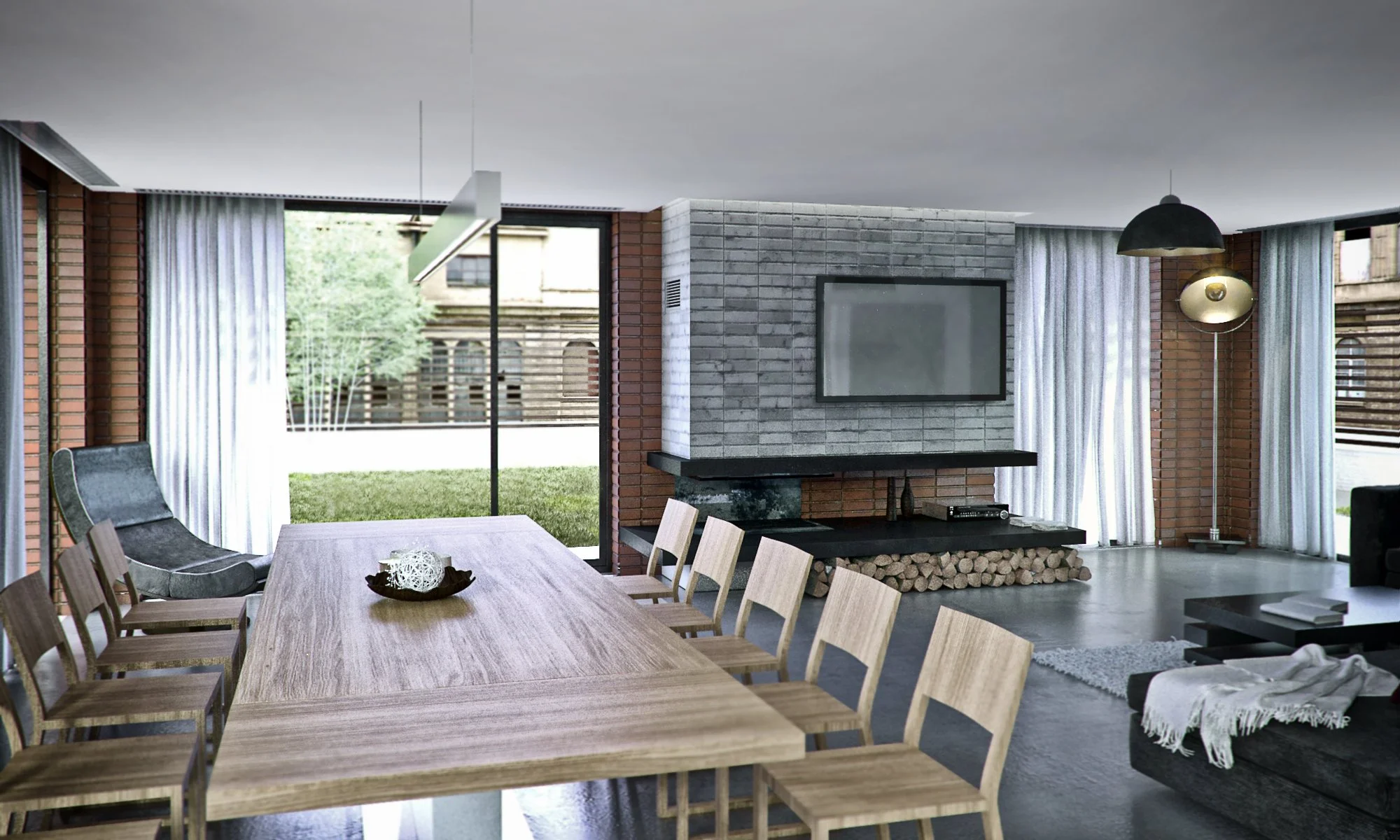 Modern living room with a large dining table, light wood chairs, a sofa, a wall-mounted TV on a brick and concrete fireplace, large windows with white curtains, and outdoor greenery visible through the windows.