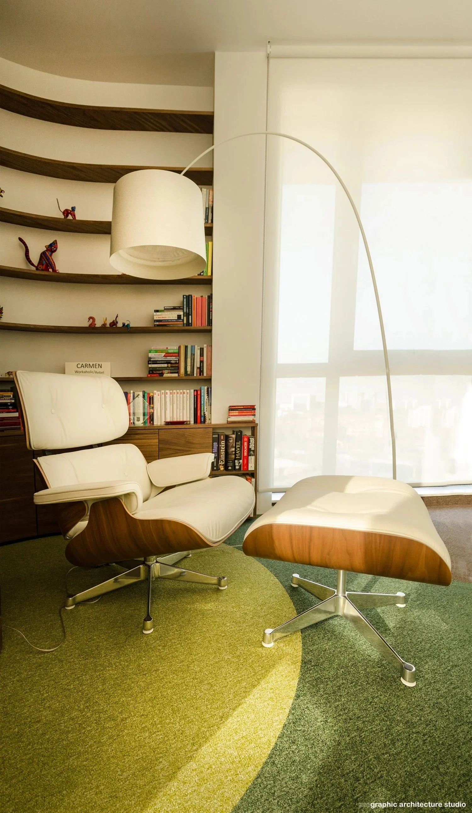 Modern living room with a white leather lounge chair and matching ottoman, a floor lamp with a white shade, a bookshelf filled with books and decorative objects, and a large window with white blinds.