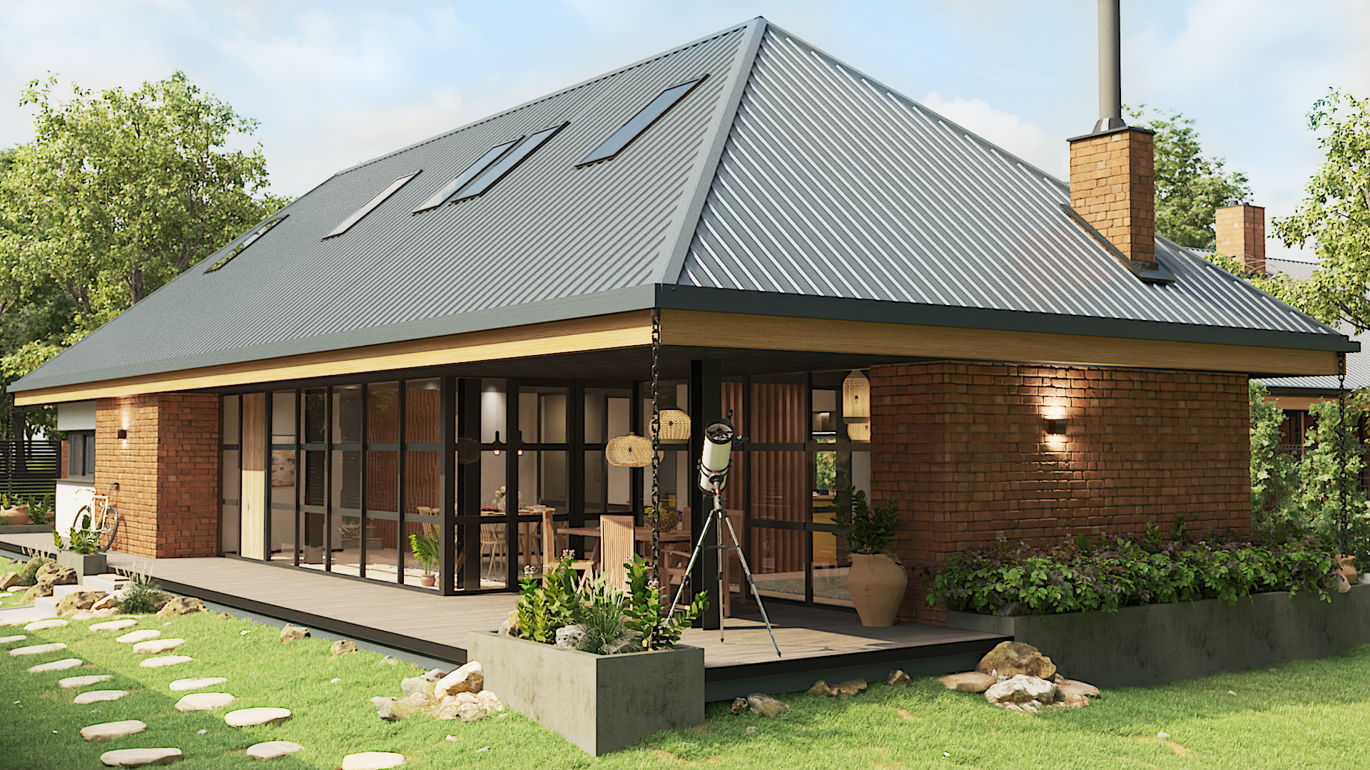A modern house with a gray metal roof, brick walls, large glass windows, and a spacious wooden deck surrounded by a green lawn and plants.