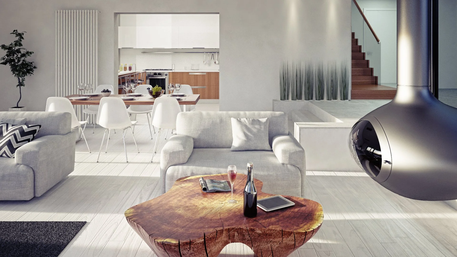 Modern living room with white sofas, a unique wooden coffee table with a wine glass and bottle, and a fireplace. In the background, an open dining area with a wooden table and white chairs, and a kitchen with white cabinets and countertops are visible.