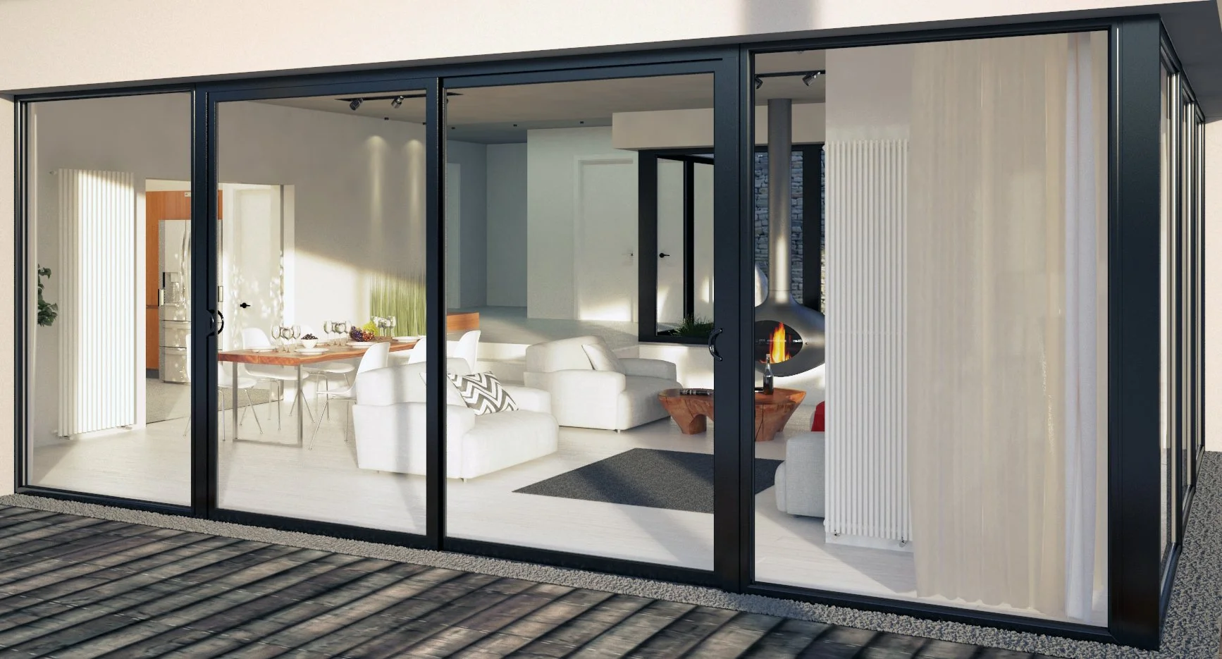 Modern living room with a fireplace, white sofas, and large glass sliding doors showing an outdoor deck.