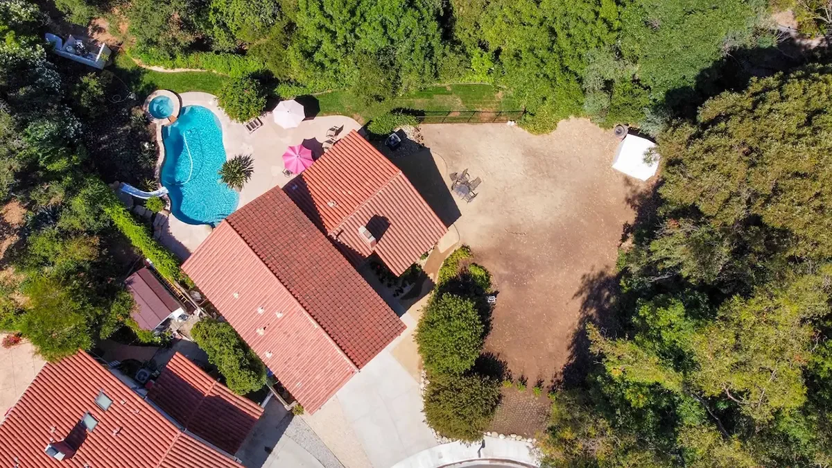 Aerial view of the backyard with swimming pool and spa at 353 Lynn Oaks Court in Thousand Oaks, CA.