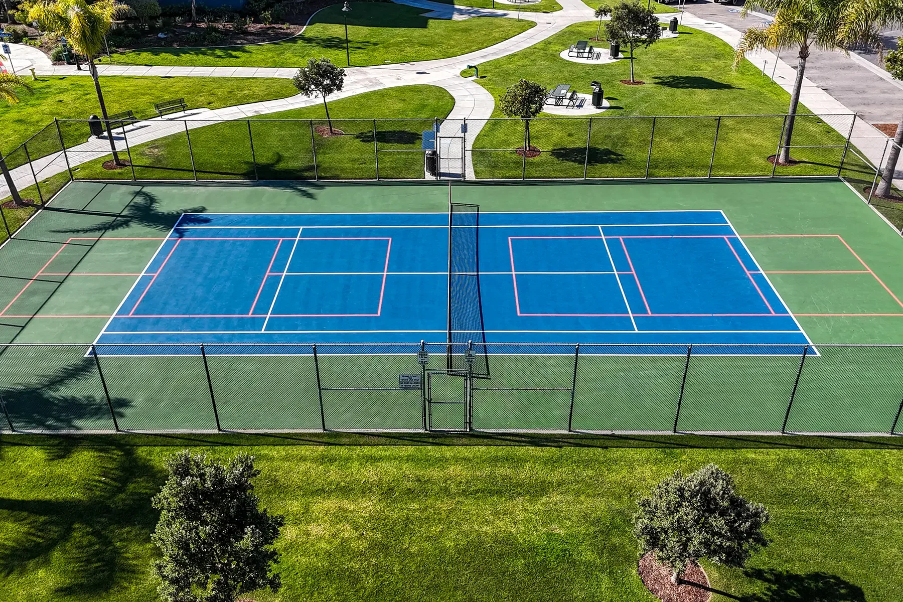 Community tennis court photo of 1901 South Victoria Avenue #115 in Oxnard, CA.