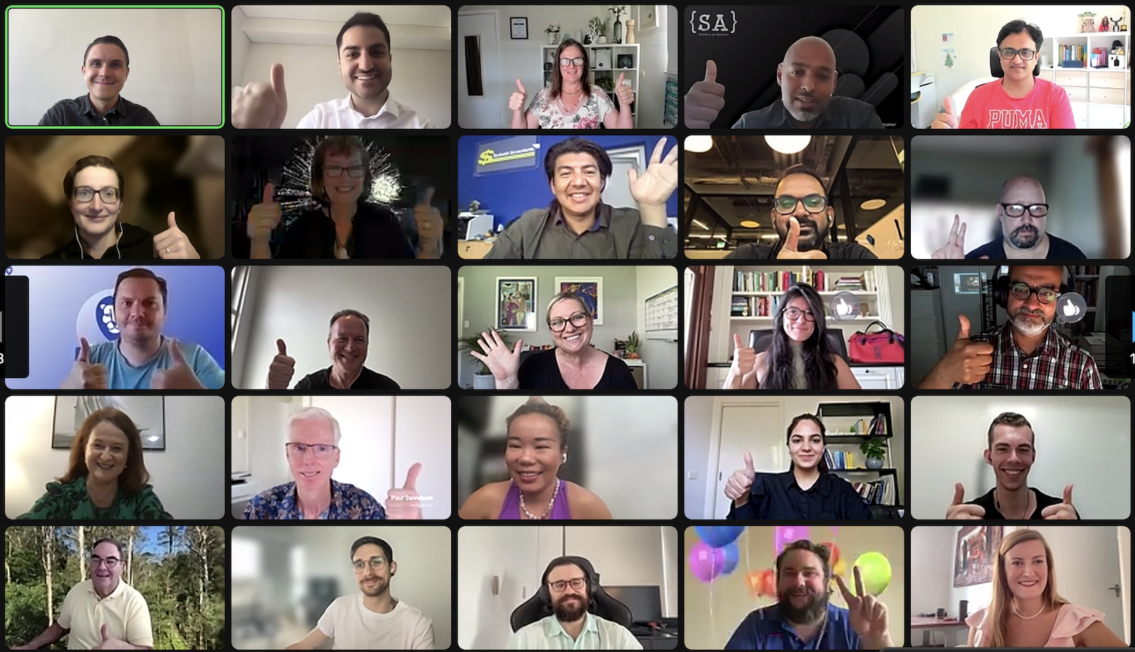 A virtual meeting with 22 diverse individuals smiling and giving thumbs up or peace signs, each in different indoor or outdoor backgrounds.