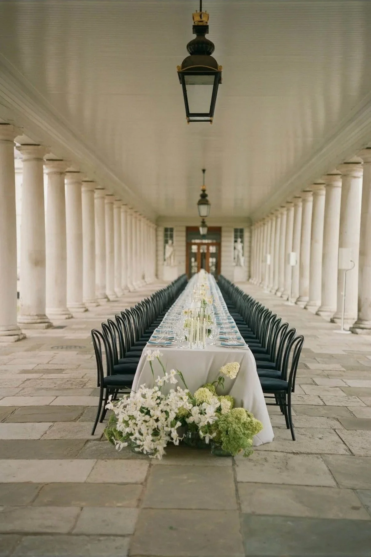 Queens-House-London-Wedding-Dinner-Outside-Collonades.jpg