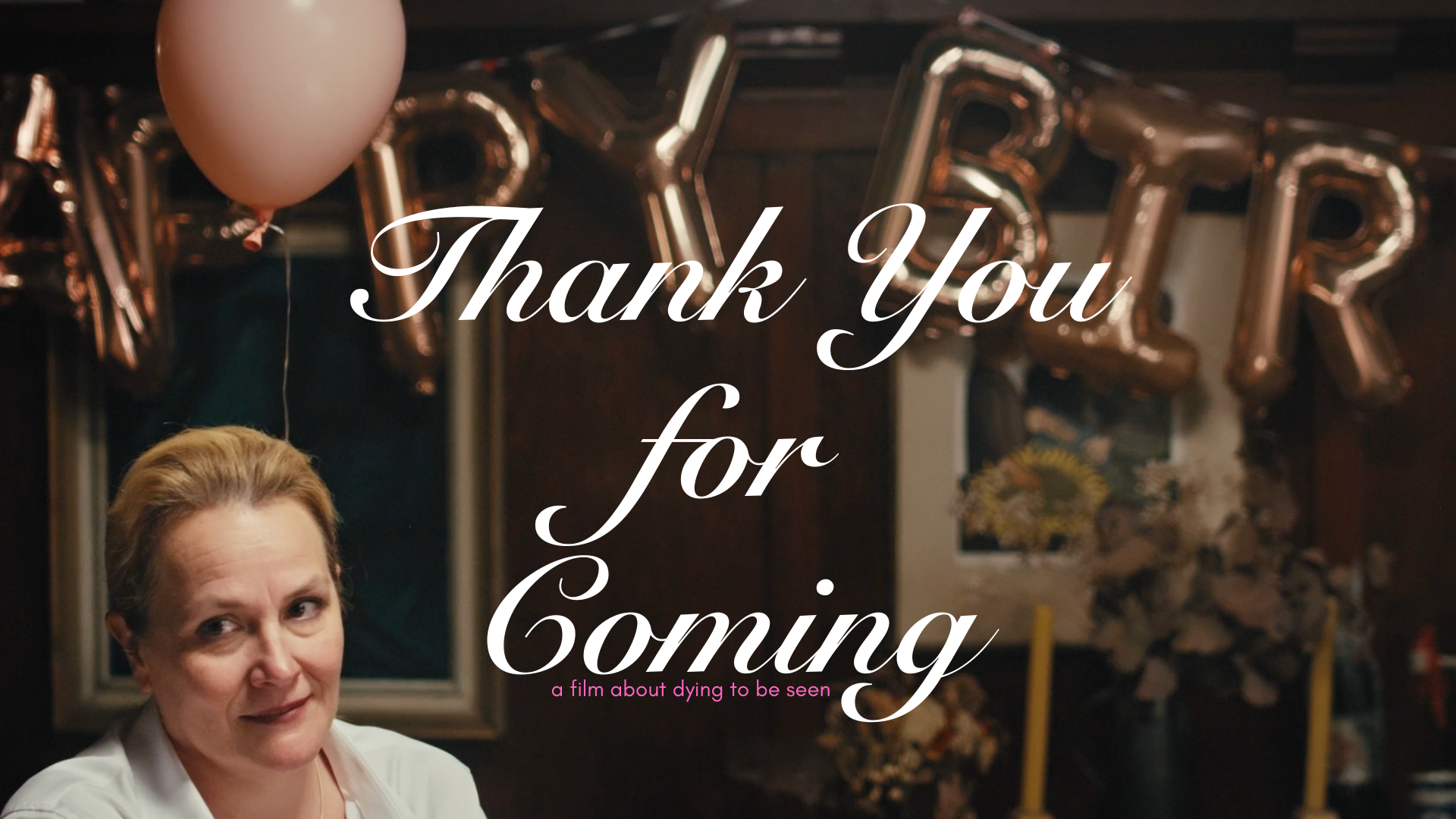 A still photo from the short film "Thank You for Coming". The character Catherine in the lower left frame with a pink birthday balloon floating beside her. Title text reads "Thank You for Coming" with the tagline "A film about dying to be seen" below