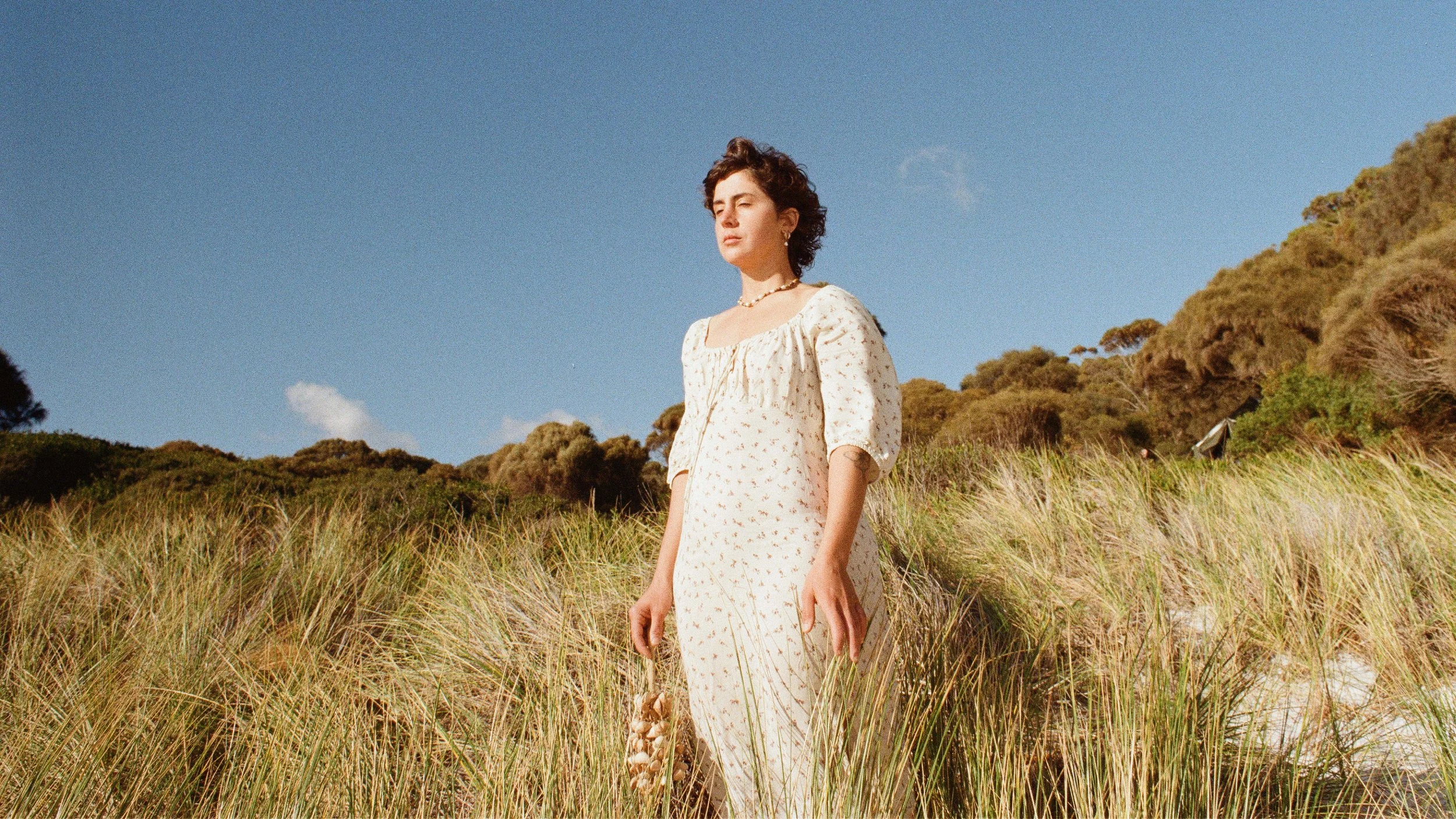 A moment to listen to the sounds around and within you, under a clear blue sky.