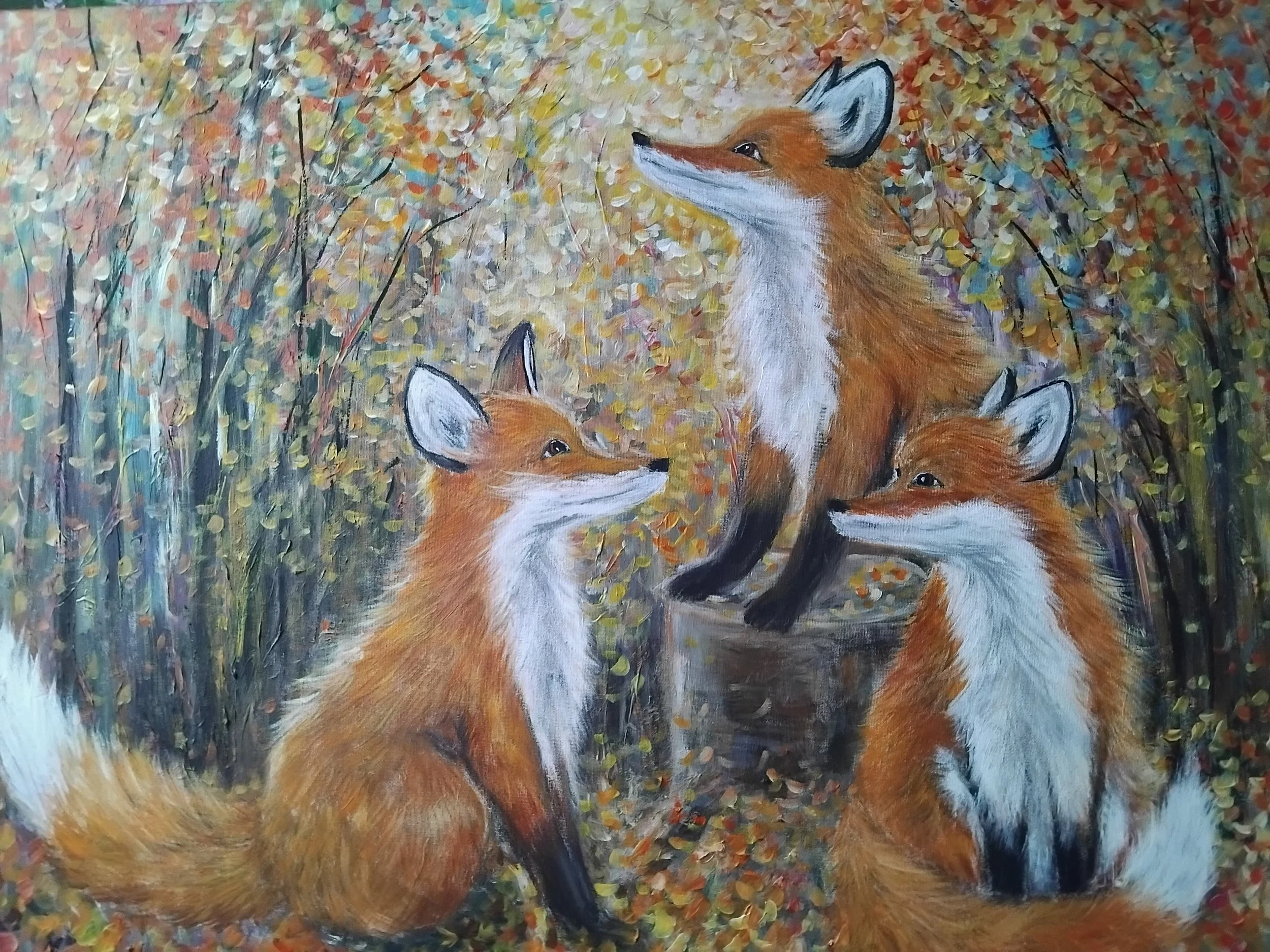 Painting of three foxes in a forest with colorful fallen leaves, one fox sitting on a tree stump and two foxes sitting nearby.