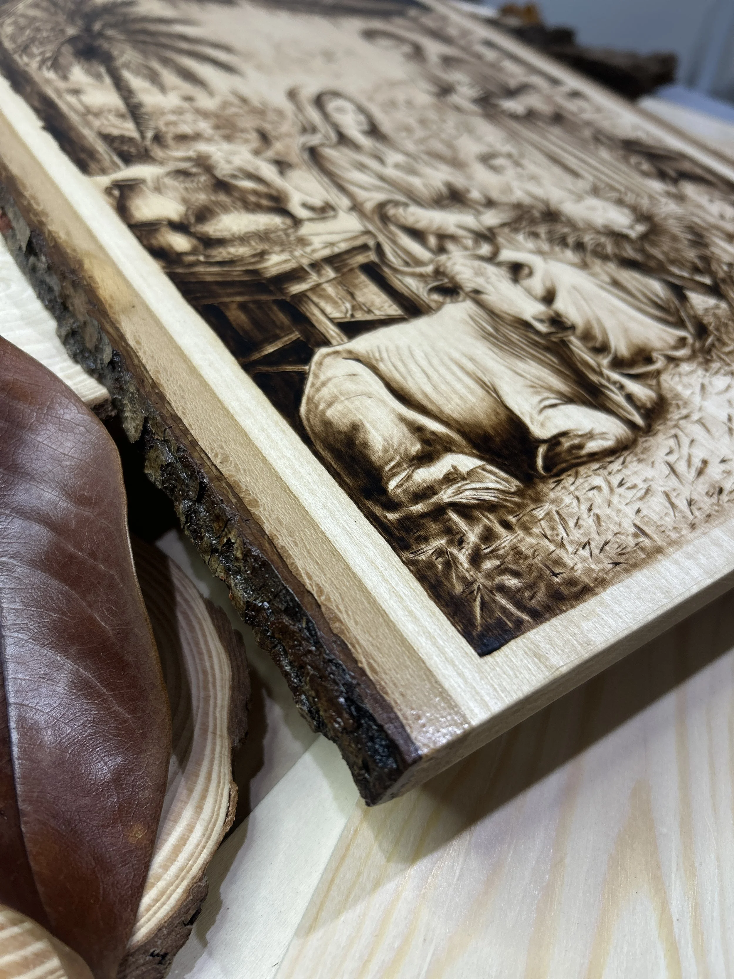 Wood-burned pyrography artworks, handcrafted fantasy art in unique, artisan, one-of-a-kind designs and decor, detailed nativity scenes on natural wood, religious festive Christmas themes