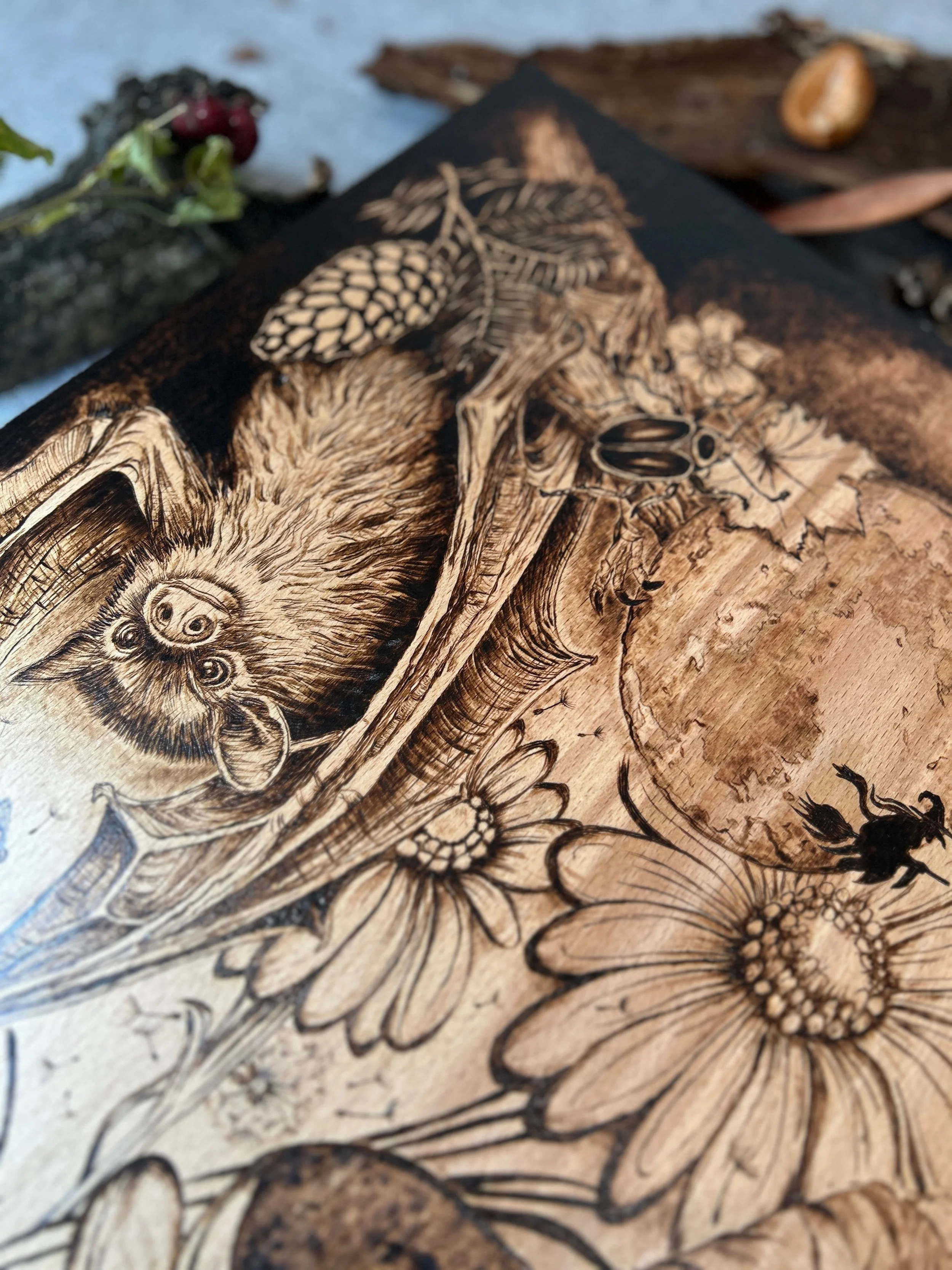 Tight close-up of forest creature in The Darkest Wishes pyrography, showing microscopic precision of fur texture burned into solid hardwood