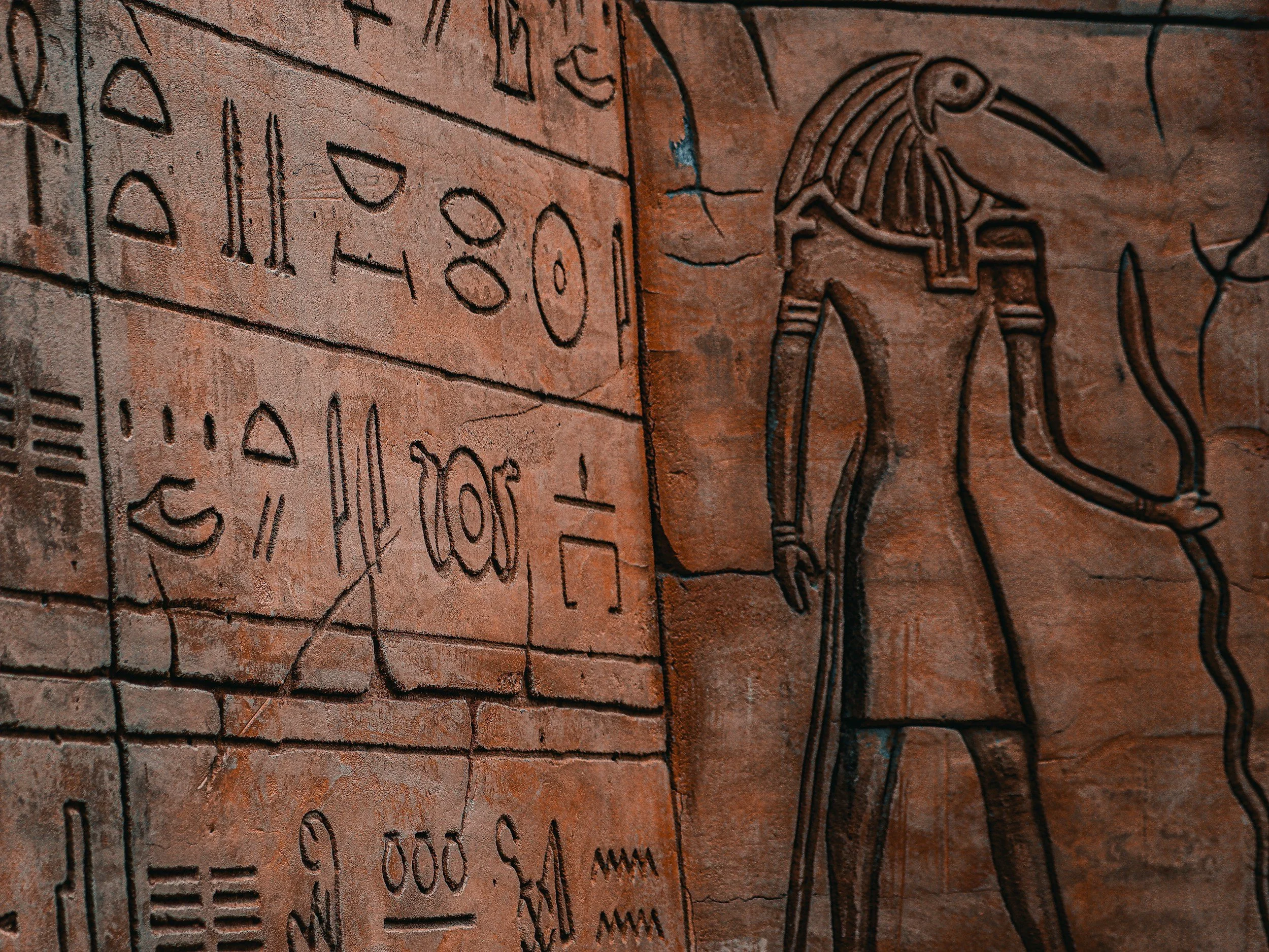 Traditional Wood-burned Egyptian artwork featuring a pharaoh design and intricate hieroglyphic details