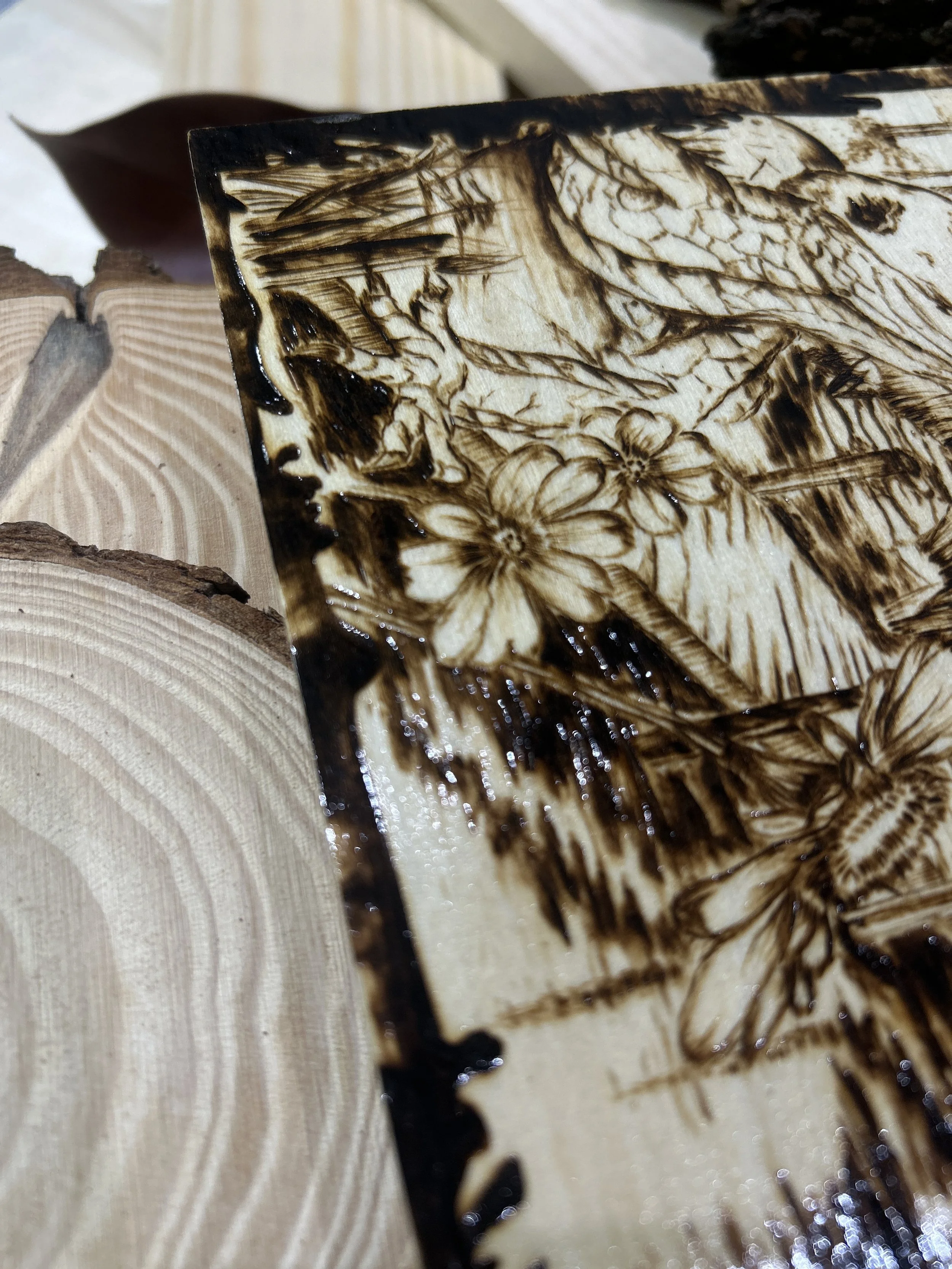 Collection of wood-burned pyrography artworks showcasing handcrafted fantasy art in unique, artisan, one-of-a-kind designs and decor, featuring detailed Dusk Hollow scenes on natural wood