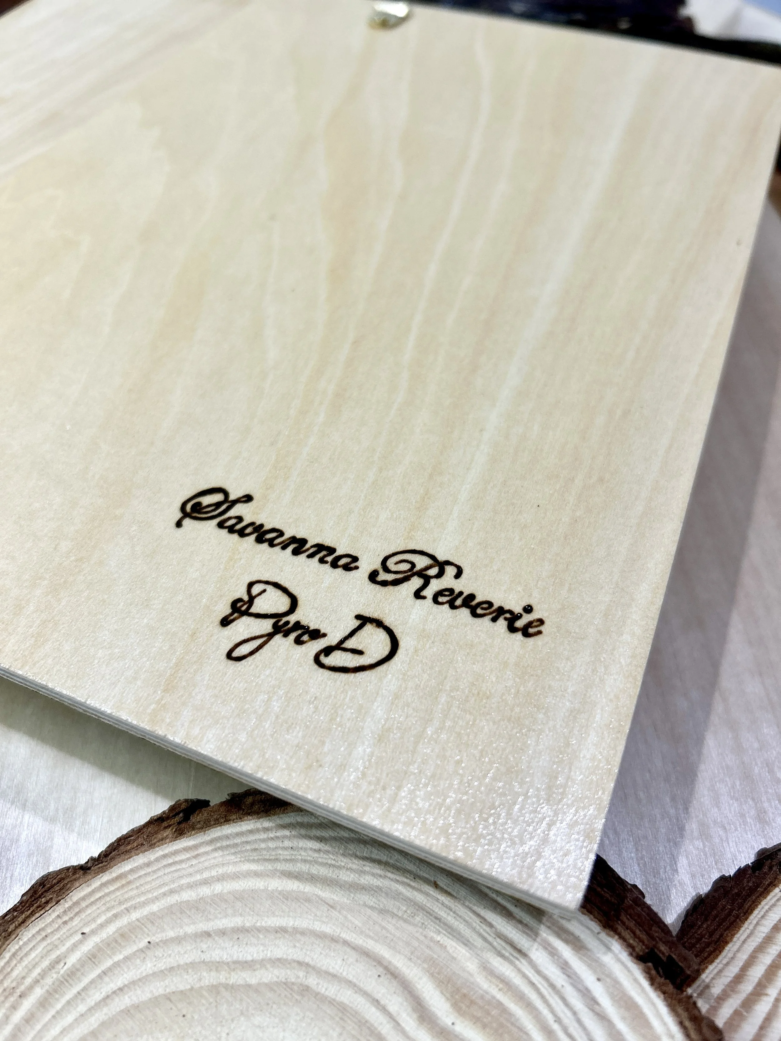 Collection of wood-burned pyrography artworks showcasing handcrafted fantasy art in unique, artisan, one-of-a-kind designs and decor, featuring detailed Savanna Reverie elephant scenes on natural wood