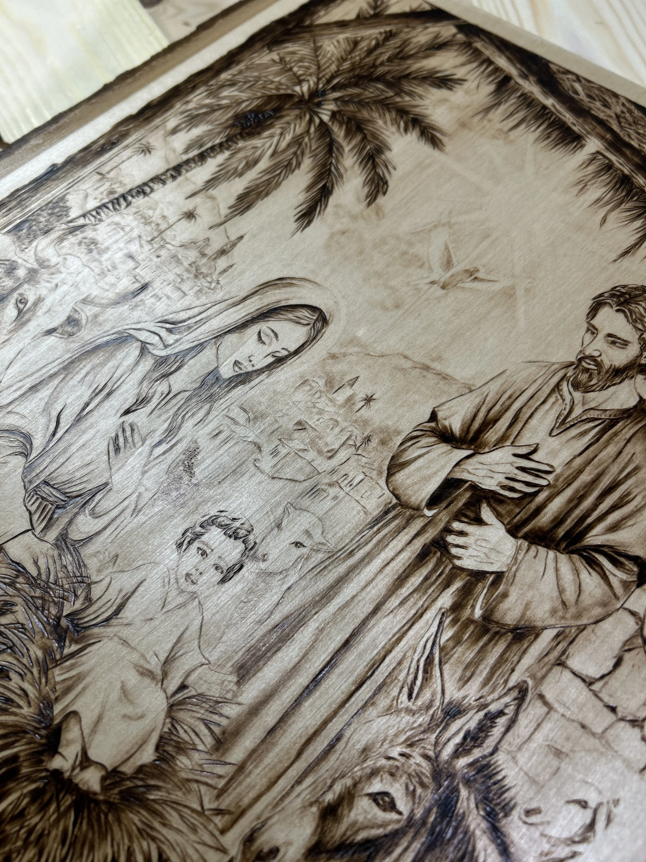 Wood-burned pyrography artworks, handcrafted fantasy art in unique, artisan, one-of-a-kind designs and decor, detailed nativity scenes on natural wood, religious festive Christmas themes