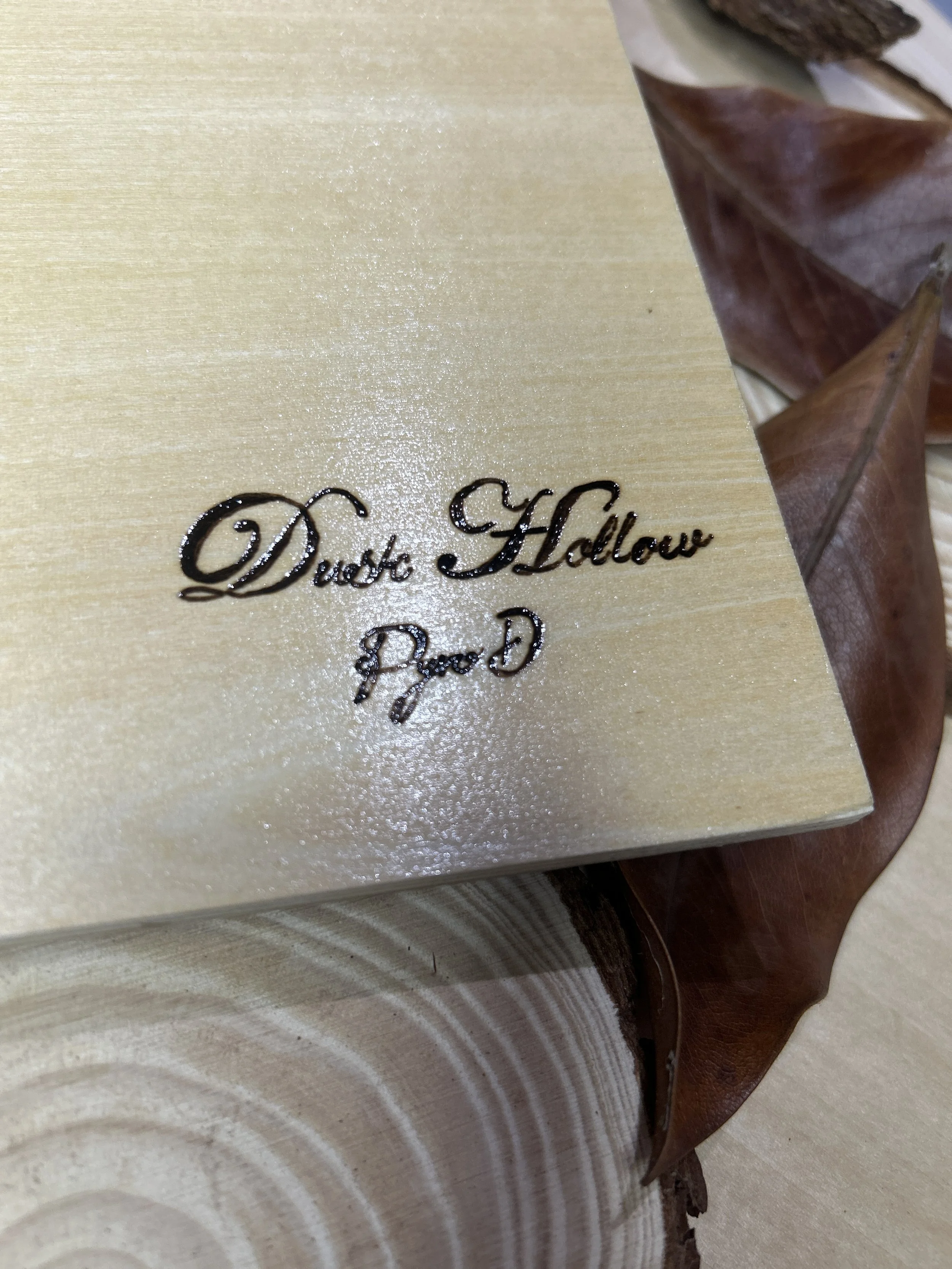 Collection of wood-burned pyrography artworks showcasing handcrafted fantasy art in unique, artisan, one-of-a-kind designs and decor, featuring detailed Dusk Hollow scenes on natural wood