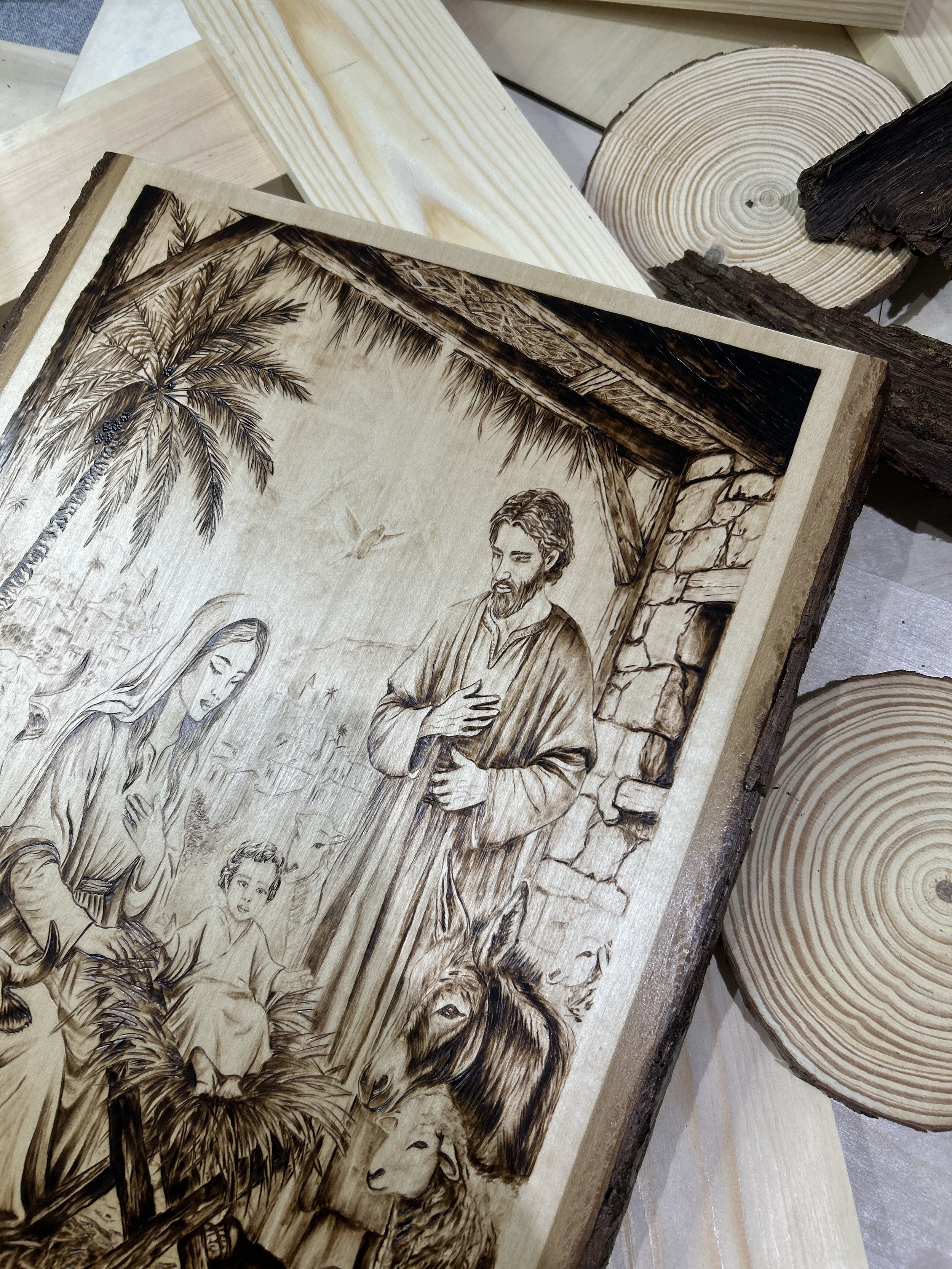 Wood-burned pyrography artworks, handcrafted fantasy art in unique, artisan, one-of-a-kind designs and decor, detailed nativity scenes on natural wood, religious festive Christmas themes