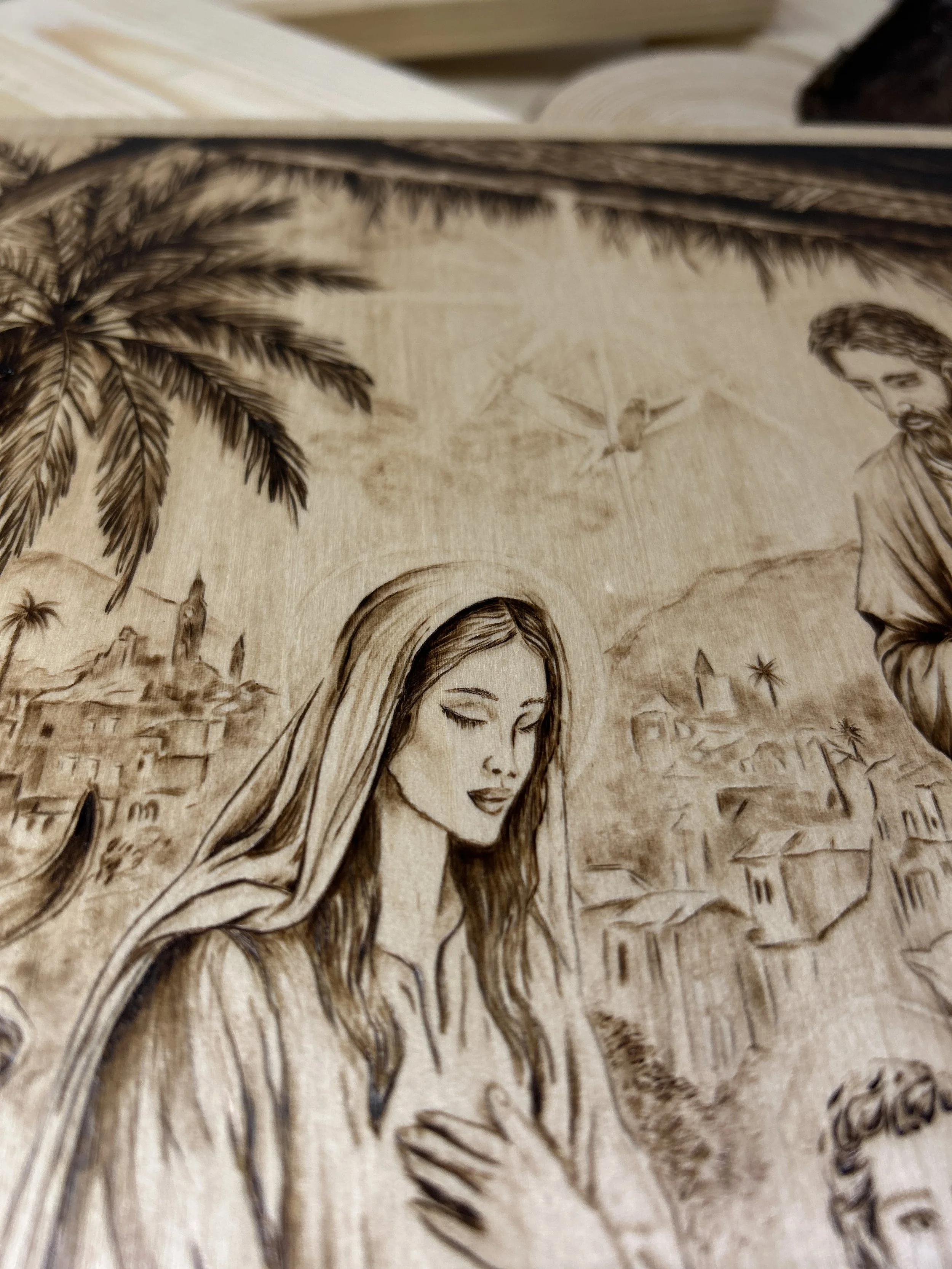 Wood-burned pyrography artworks, handcrafted fantasy art in unique, artisan, one-of-a-kind designs and decor, detailed nativity scenes on natural wood, religious festive Christmas themes