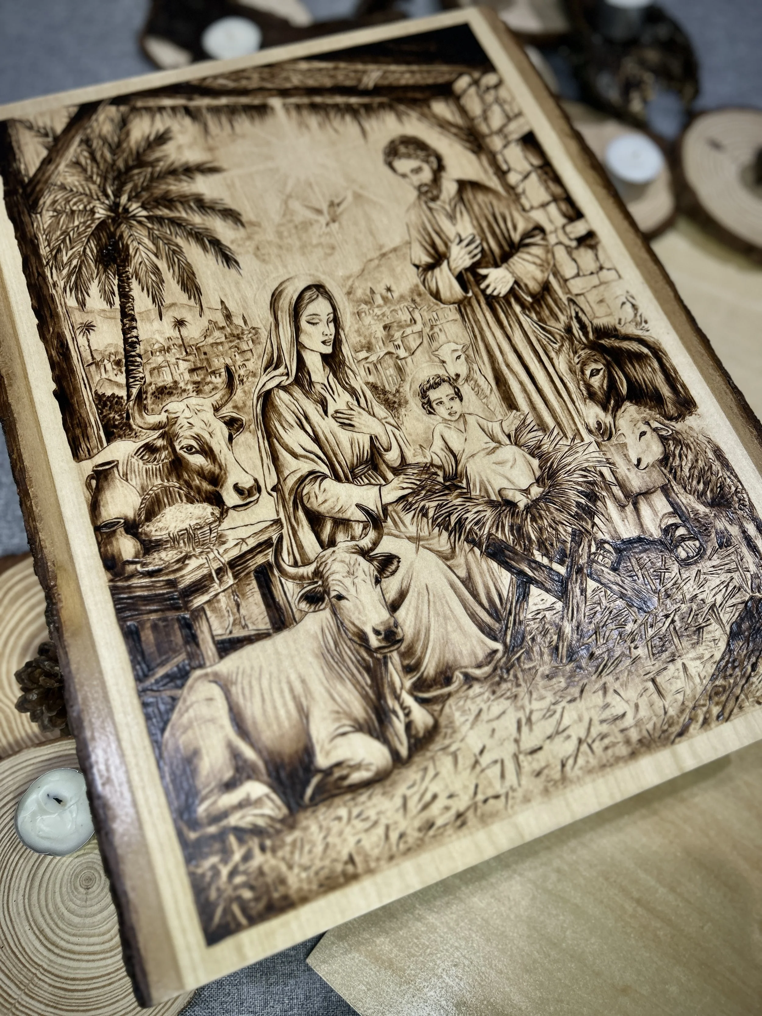 Side angle view of Stable Of Grace pyrography, showing depth on solid hardwood timber