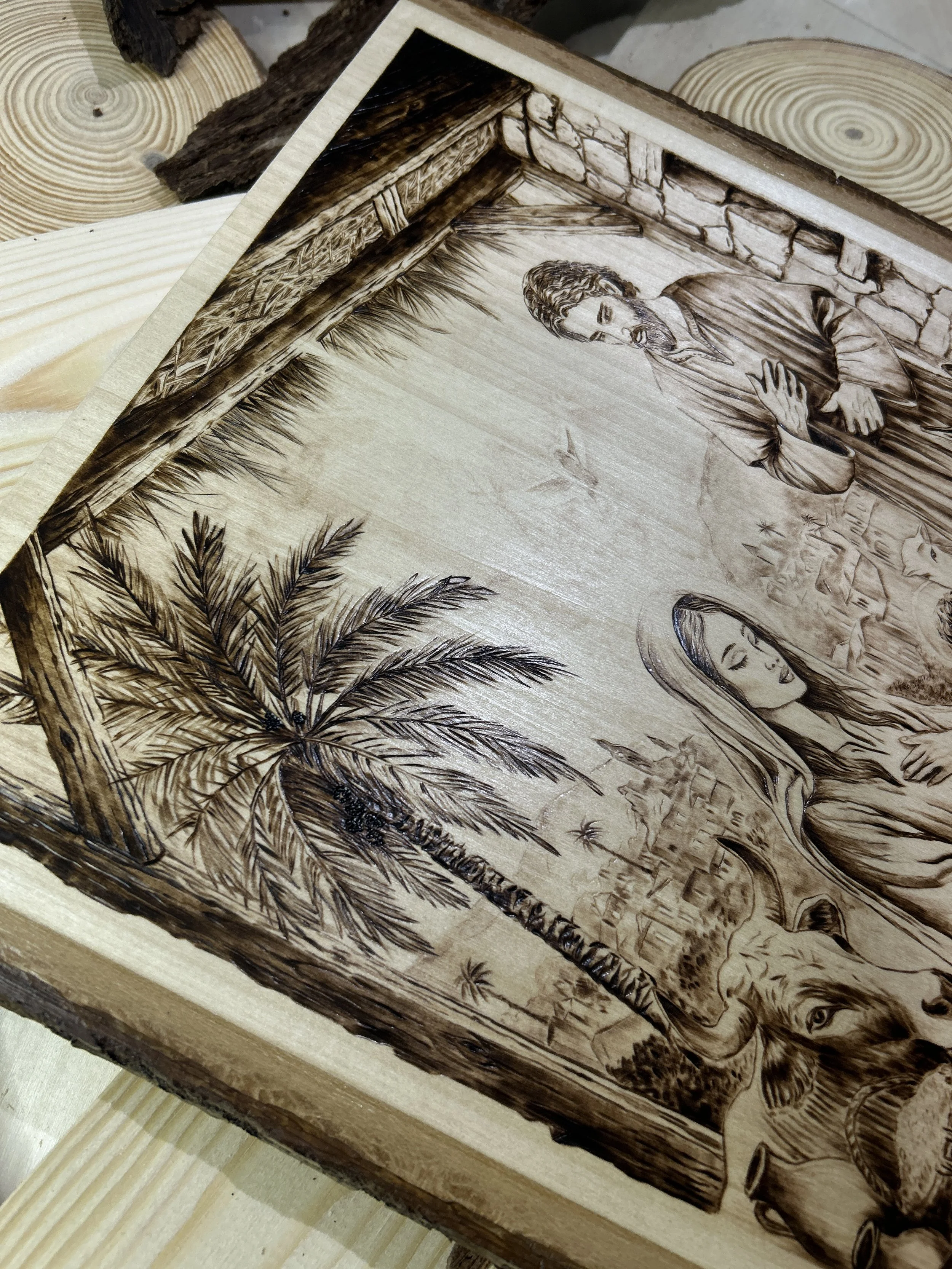 Wood-burned pyrography artworks, handcrafted fantasy art in unique, artisan, one-of-a-kind designs and decor, detailed nativity scenes on natural wood, religious festive Christmas themes