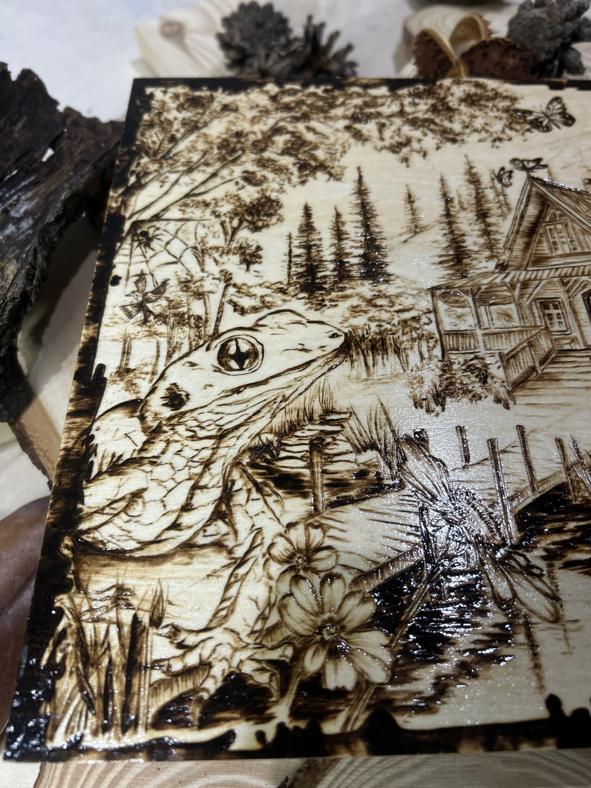 Collection of wood-burned pyrography artworks showcasing handcrafted fantasy art in unique, artisan, one-of-a-kind designs and decor, featuring detailed Dusk Hollow scenes on natural wood