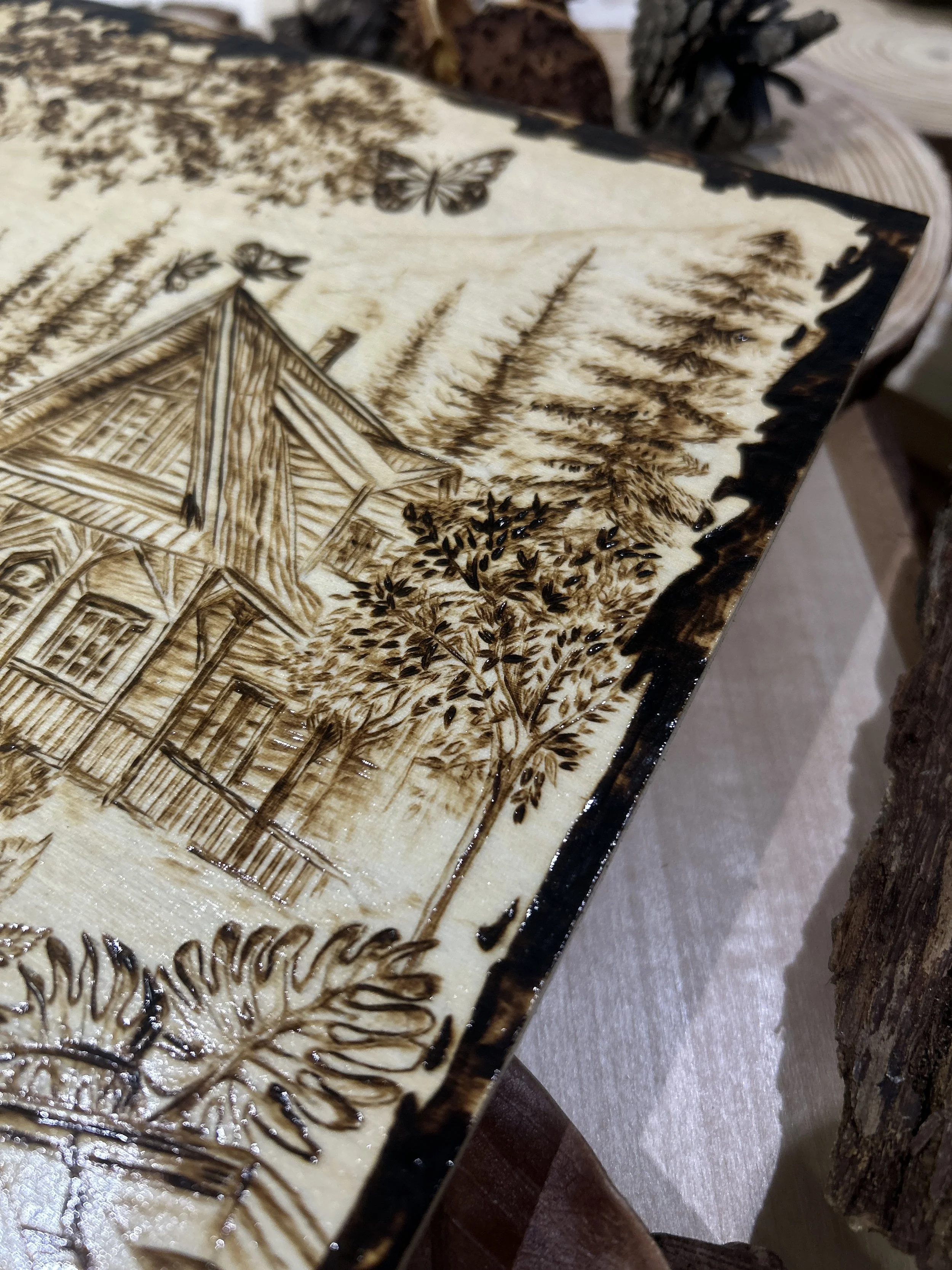 Collection of wood-burned pyrography artworks showcasing handcrafted fantasy art in unique, artisan, one-of-a-kind designs and decor, featuring detailed Dusk Hollow scenes on natural wood