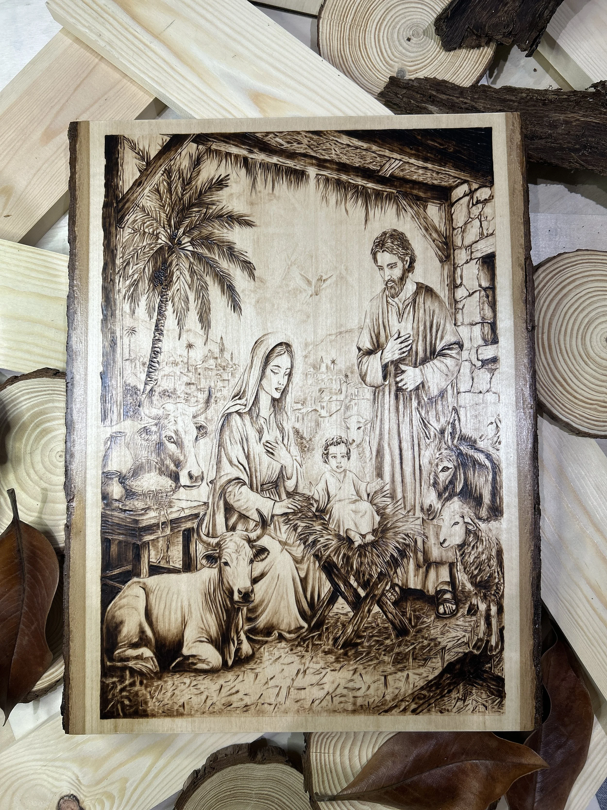 Wood-burned pyrography artworks, handcrafted fantasy art in unique, artisan, one-of-a-kind designs and decor, detailed nativity scenes on natural wood, religious festive Christmas themes