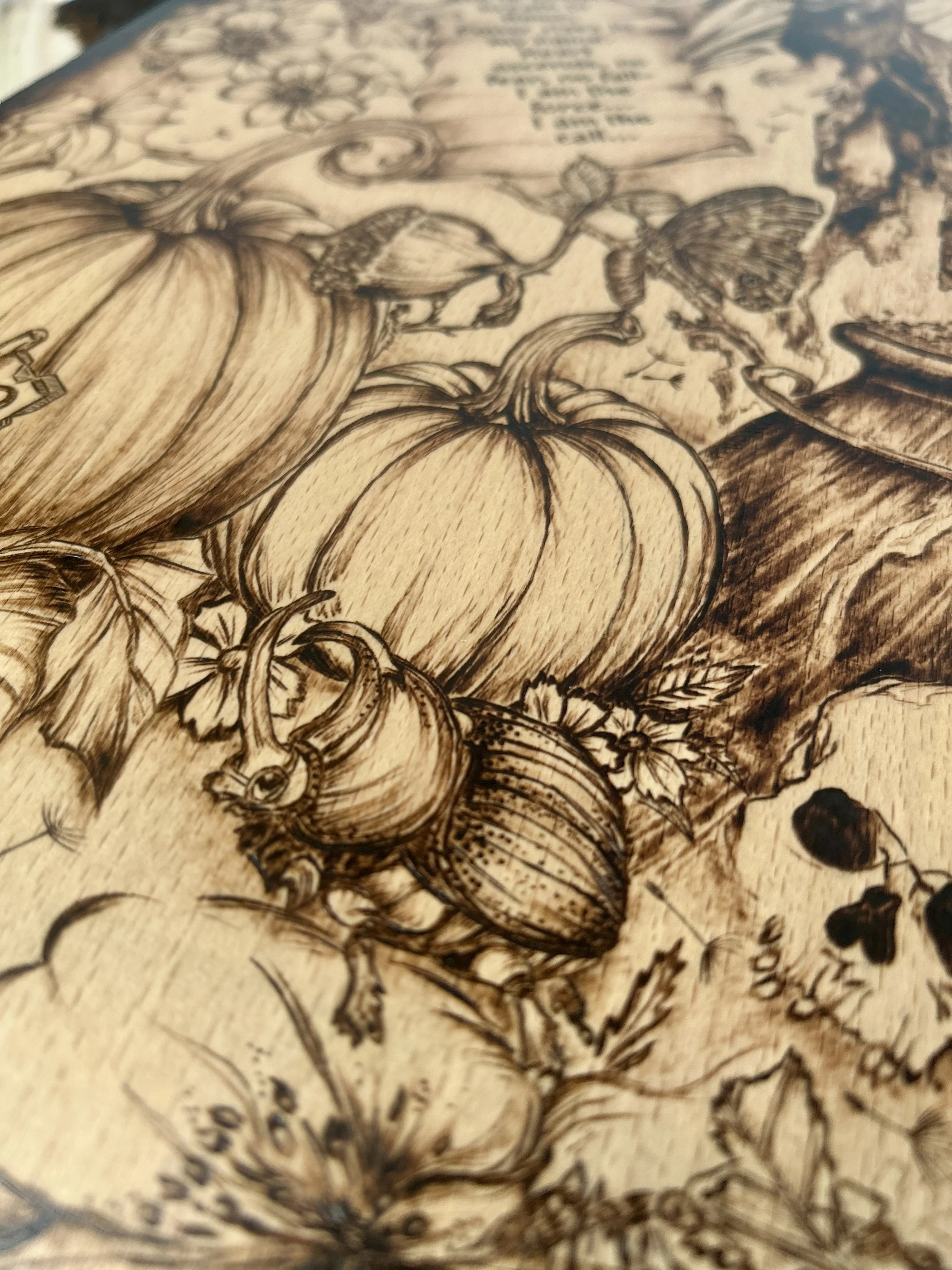 Detailed view of wood-burned pumpkins and autumn foliage, showcasing the cross-hatching and shading techniques.