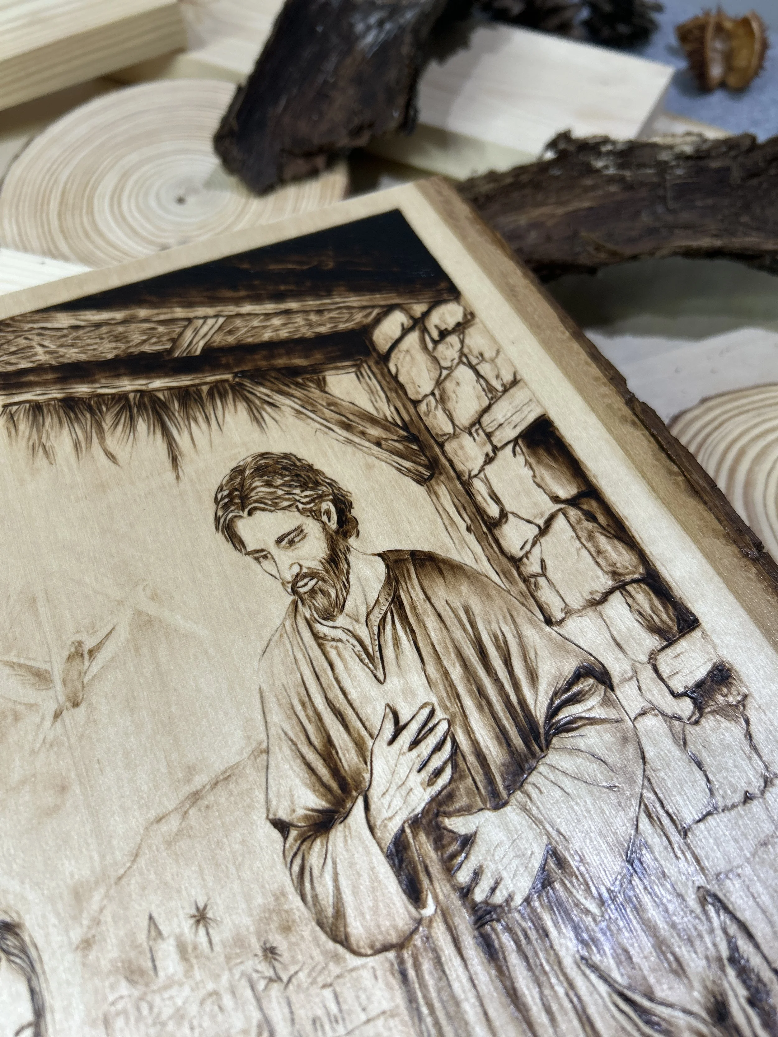 Wood-burned pyrography artworks, handcrafted fantasy art in unique, artisan, one-of-a-kind designs and decor, detailed nativity scenes on natural wood, religious festive Christmas themes