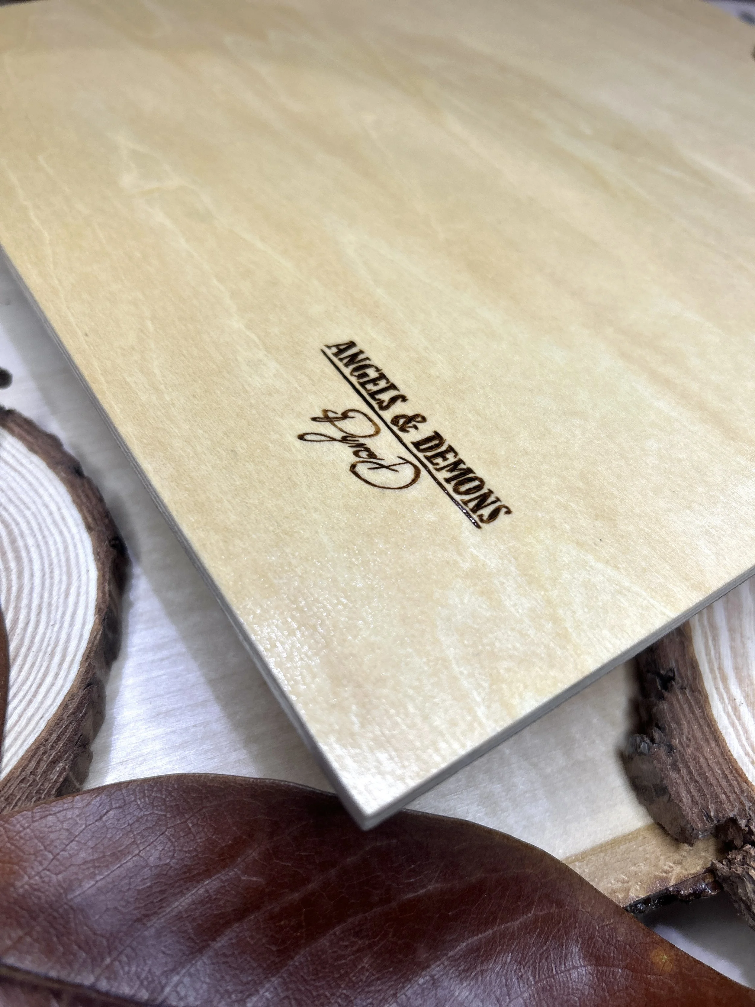Collection of wood-burned pyrography artworks featuring angels and demons, showcasing handcrafted fantasy art in unique, artisan, one-of-a-kind designs and decor