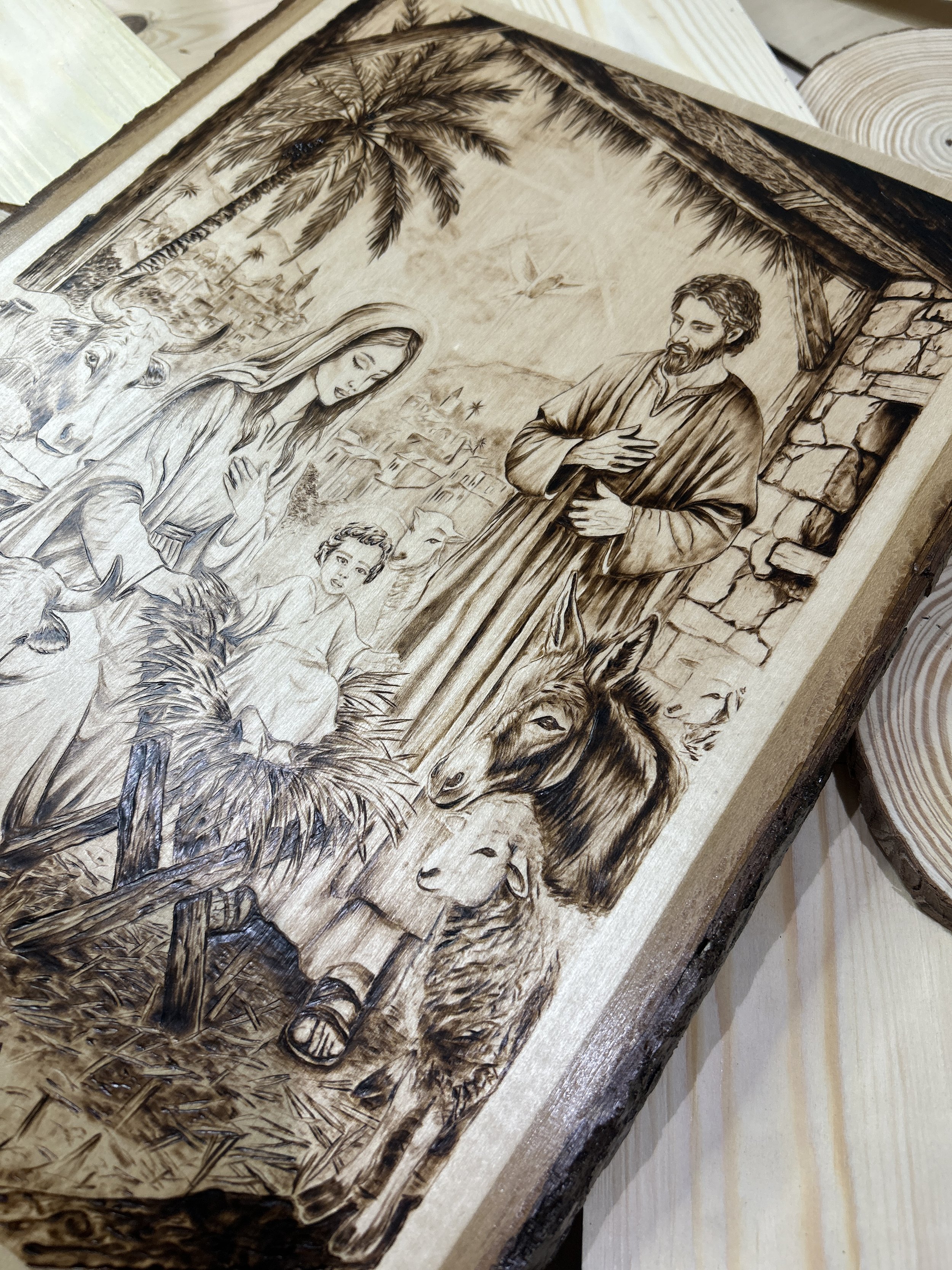 Wood-burned pyrography artworks, handcrafted fantasy art in unique, artisan, one-of-a-kind designs and decor, detailed nativity scenes on natural wood, religious festive Christmas themes