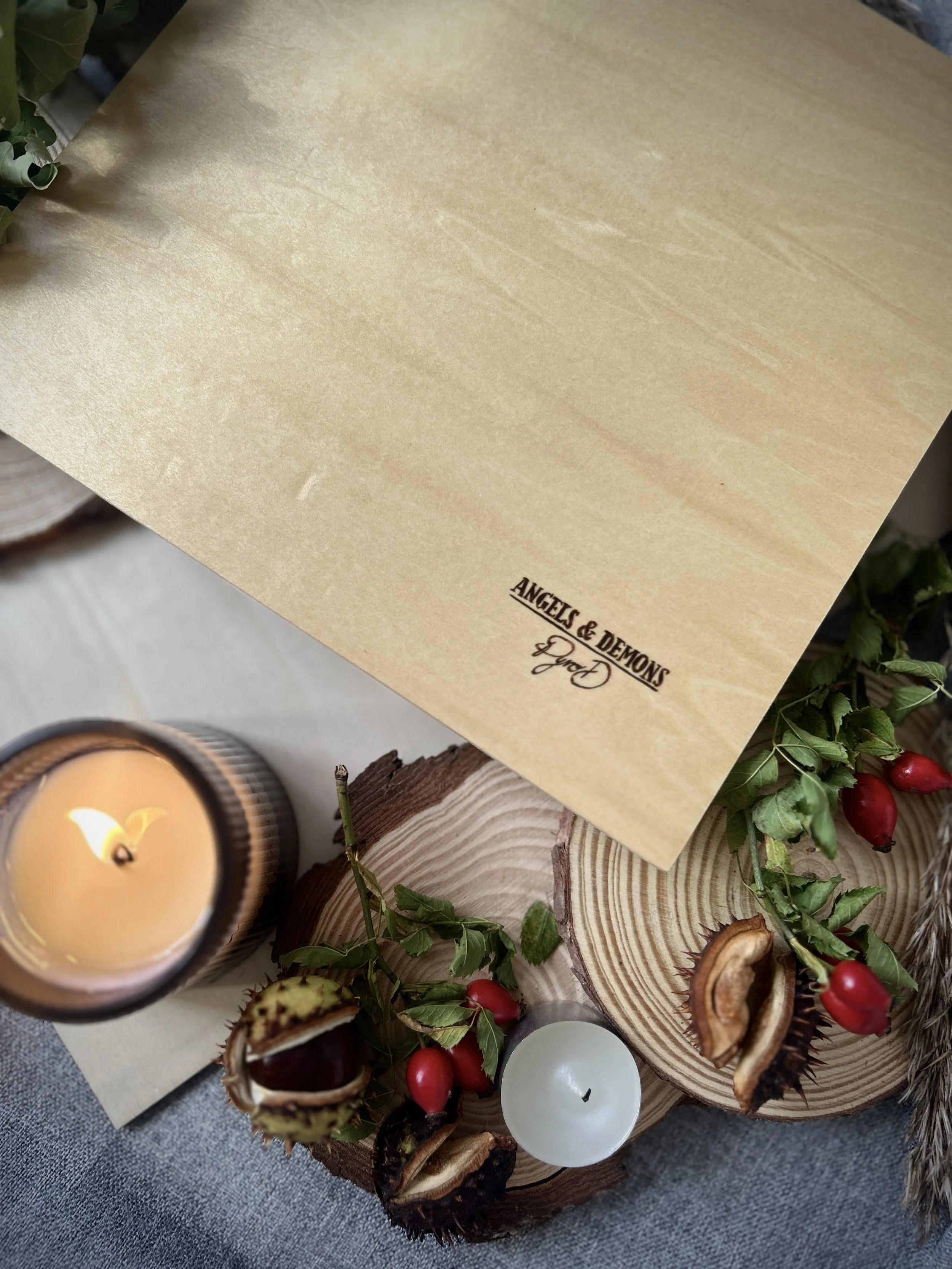Collection of wood-burned pyrography artworks featuring angels and demons, showcasing handcrafted fantasy art in unique, artisan, one-of-a-kind designs and decor